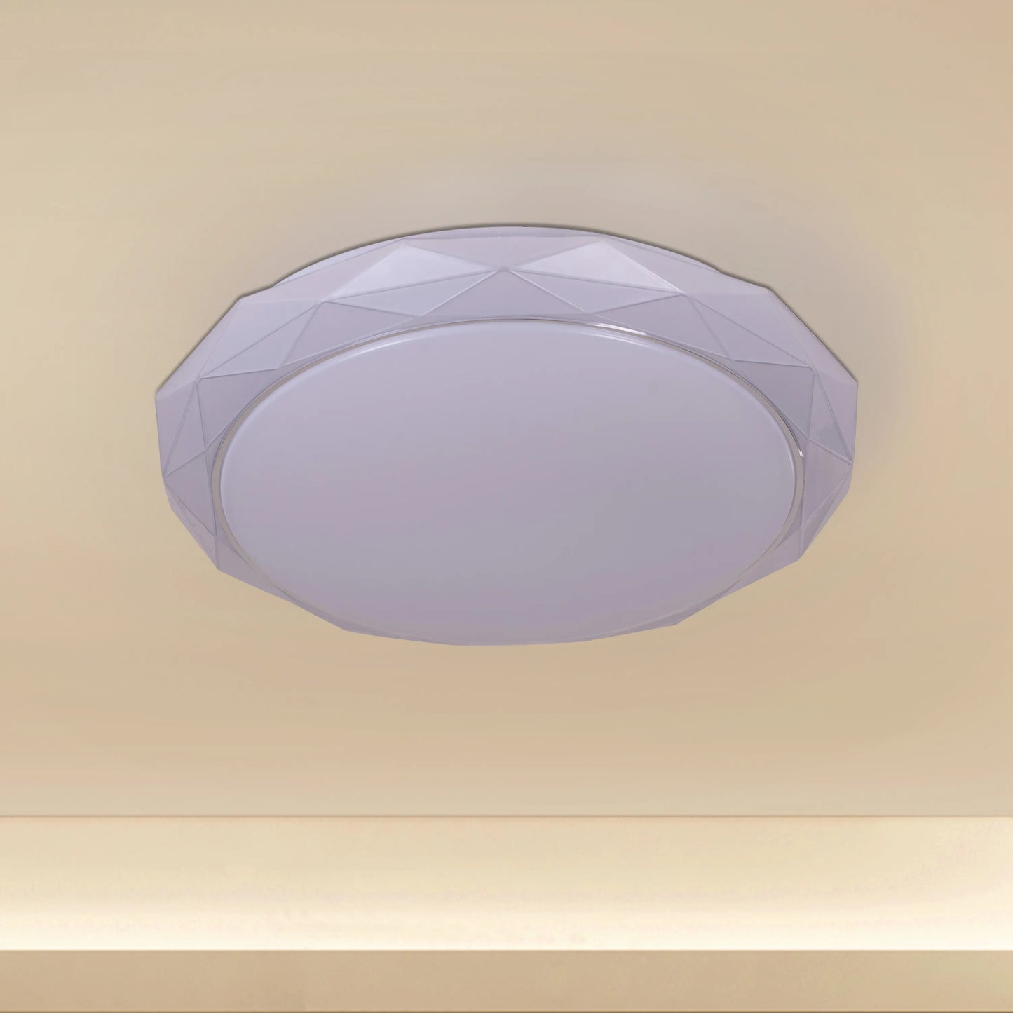 Chrome ceiling light with sleek design and built-in LED lights, displaying warm white illumination