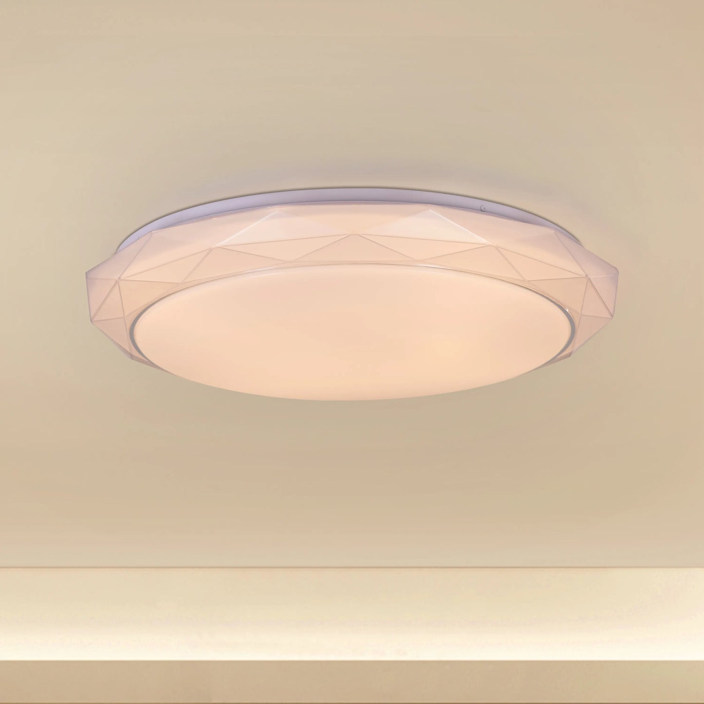 Chrome ceiling light with sleek design and built-in LED lights, displaying warm white illumination
