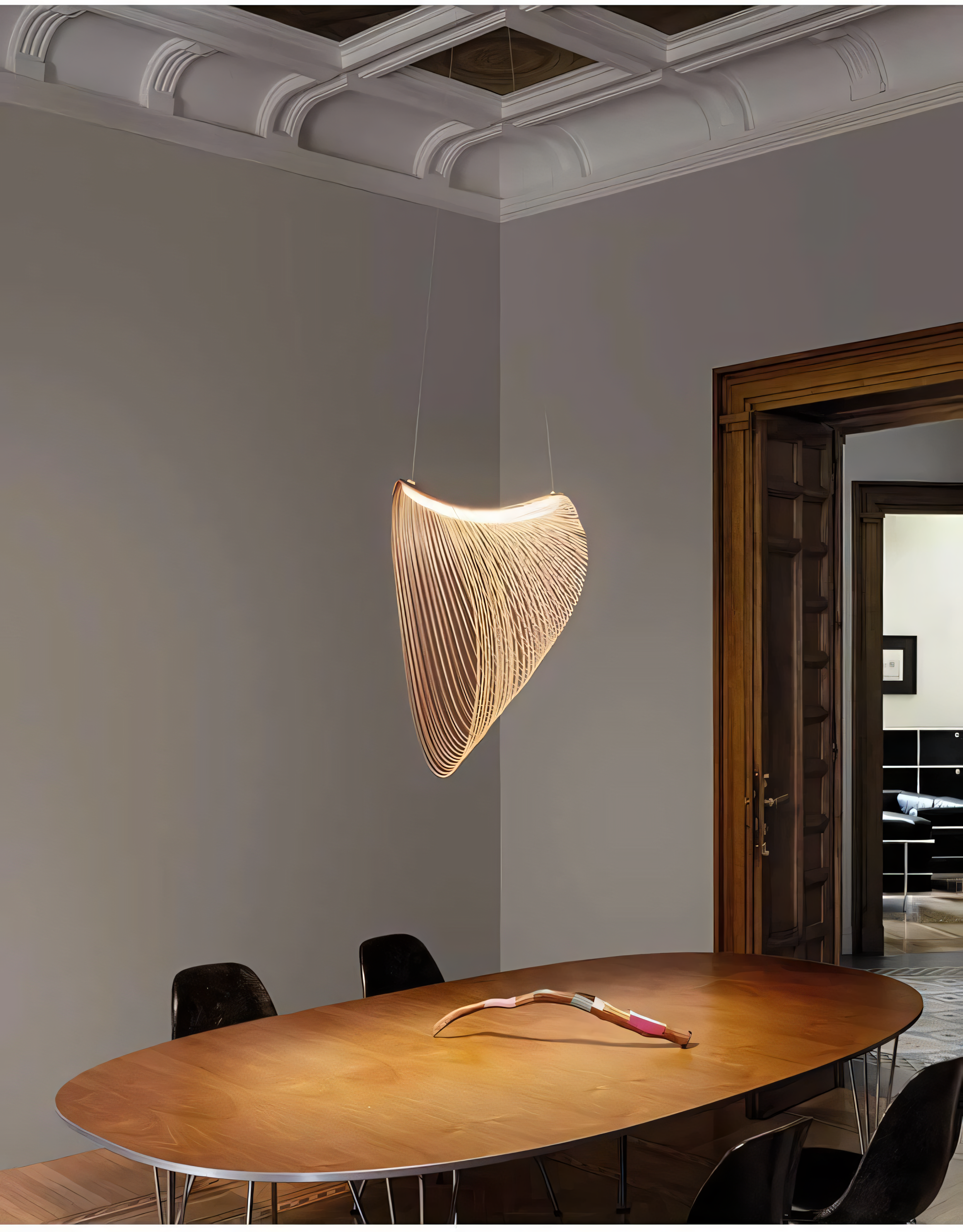 Rattan hanging light fixture in a modern living room.