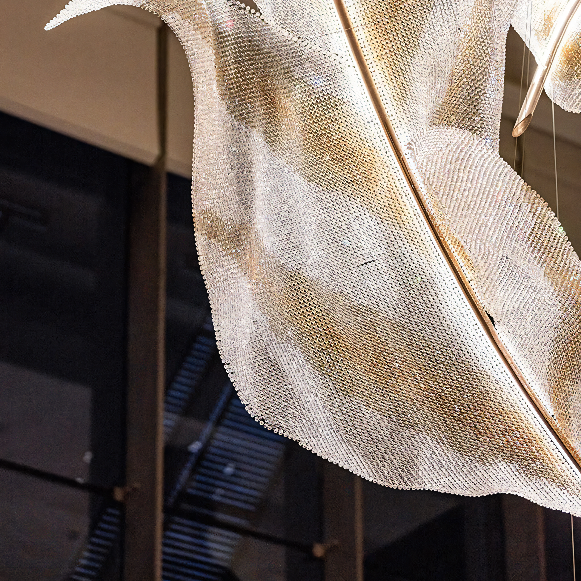 Mesmerizing play of light and movement from the Raffia Orbifolia Radiance Pendant