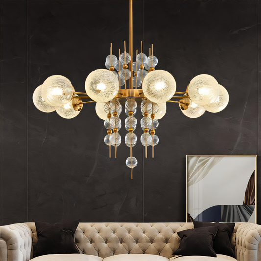 A chrome chandelier with eight clear glass globes hangs from a dining room ceiling. The chandelier casts a warm, inviting glow on the space.