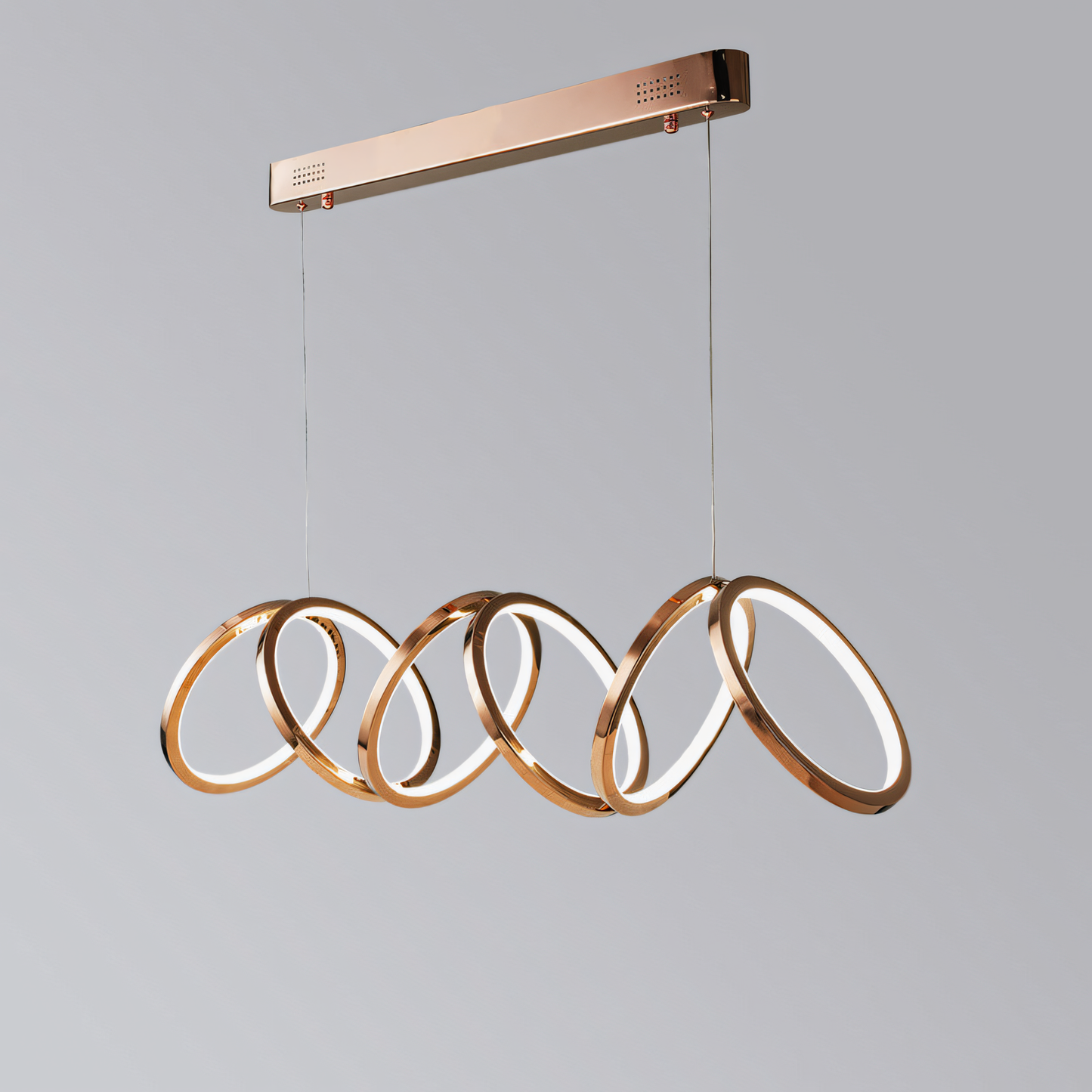 This modern rose gold chandelier features a cascading ring design, adding a touch of warmth and sophistication to your space.