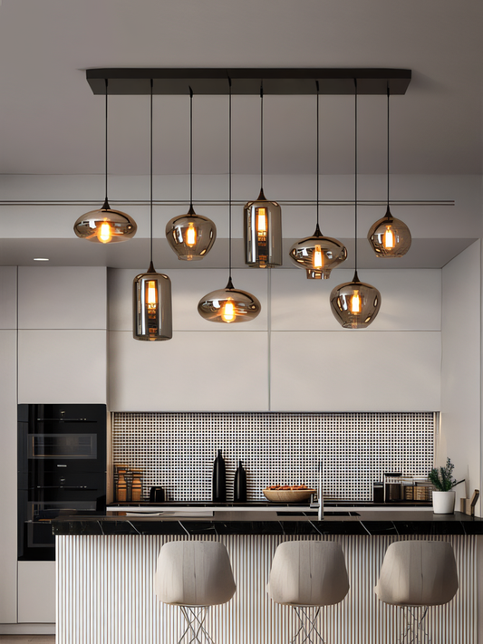 A black, eight-light chandelier with smoky glass globes hangs from a dining room ceiling. The chandelier casts a warm, inviting glow on the space.