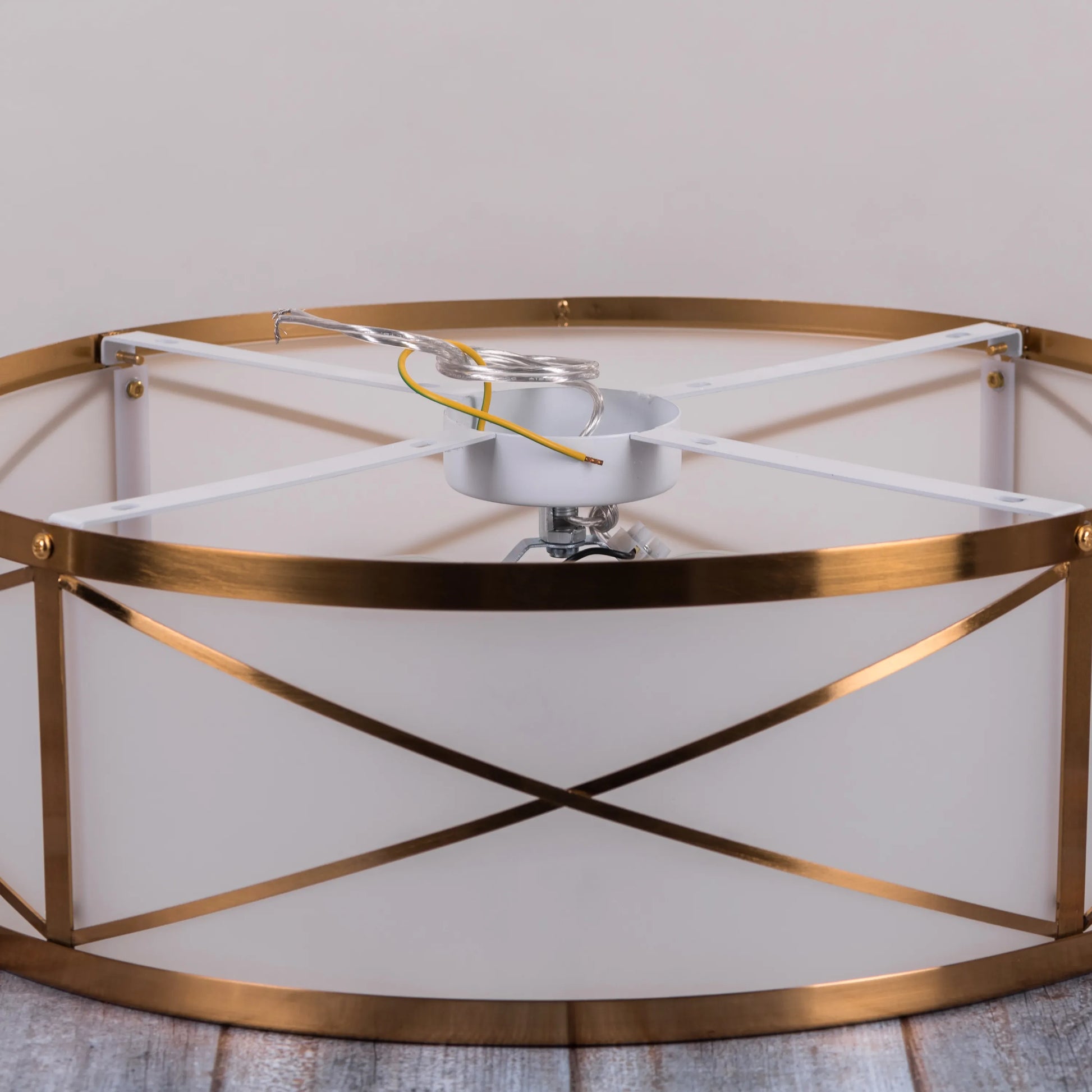 Elegant ceiling light with luxurious gold accents.