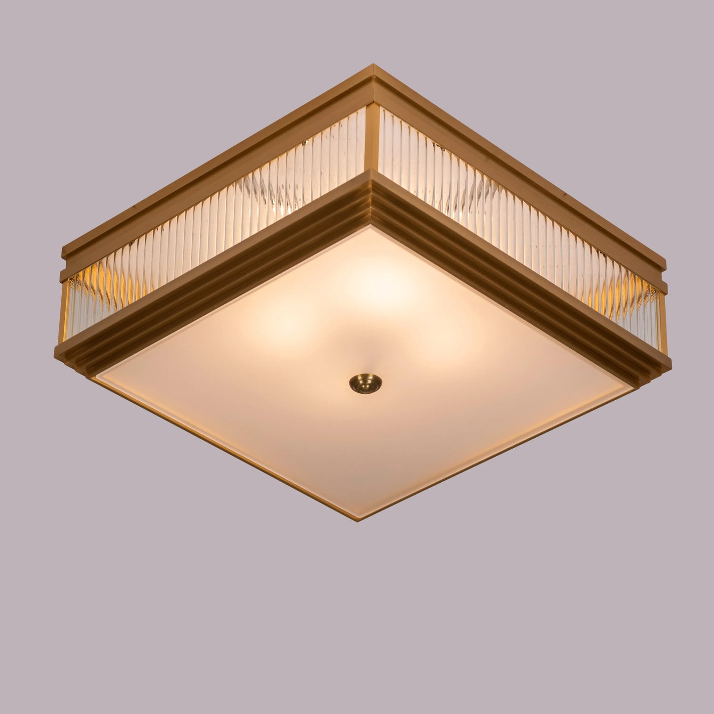 Live & Learn Gold Ceiling Light casting a warm glow in an elegant living room