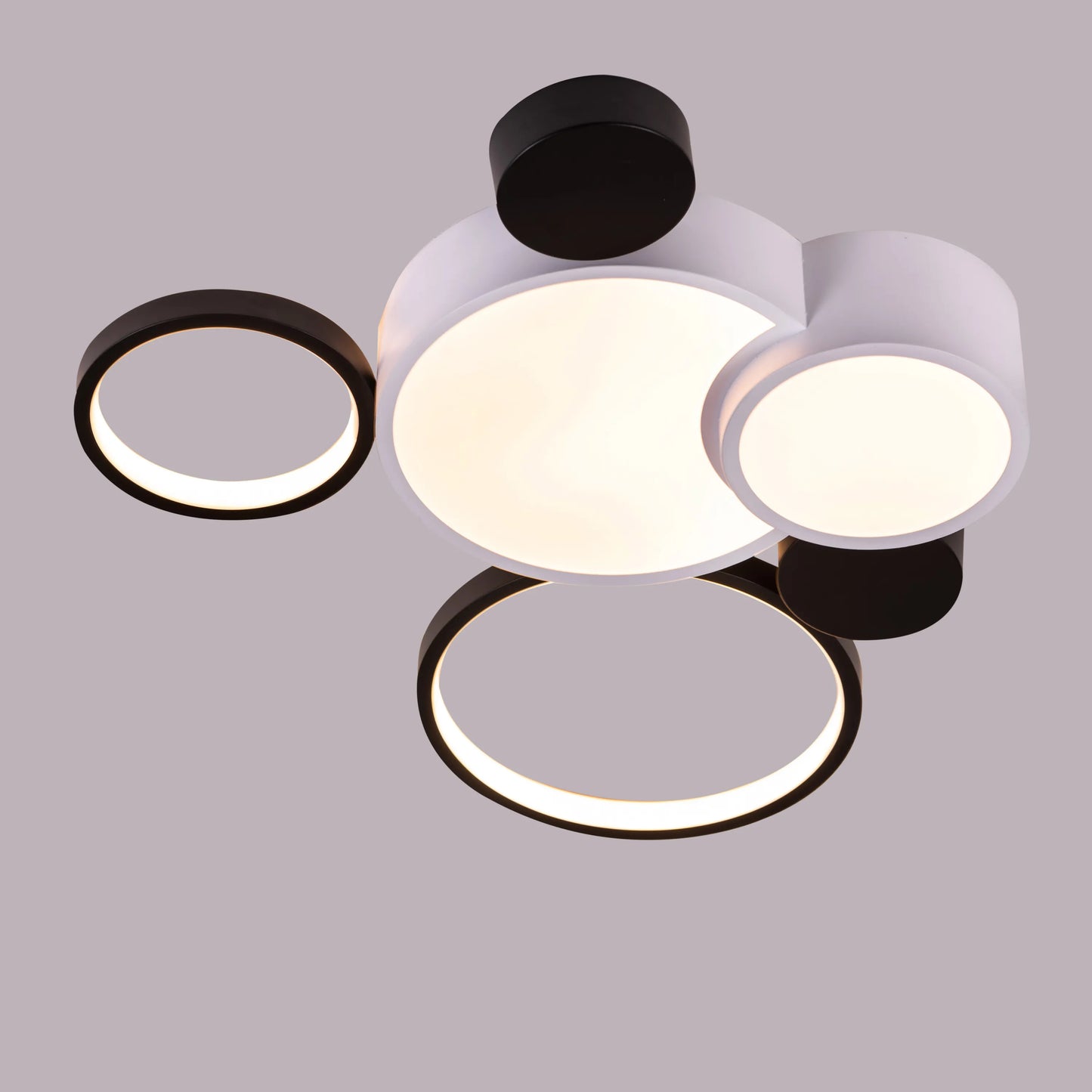 Medium-sized Heat Wave LED ceiling light brightening a cozy bedroom