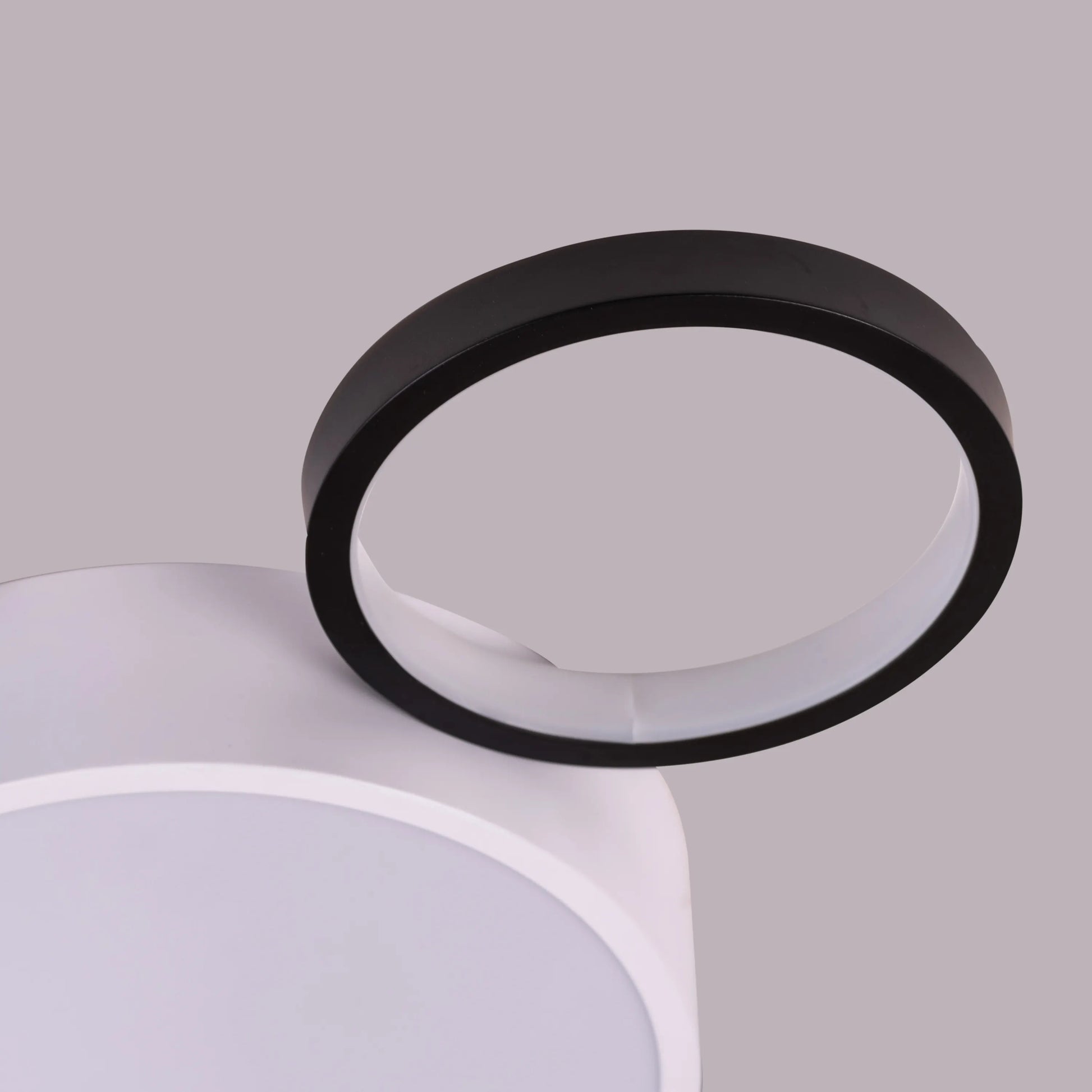 Medium-sized Heat Wave LED ceiling light brightening a cozy bedroom