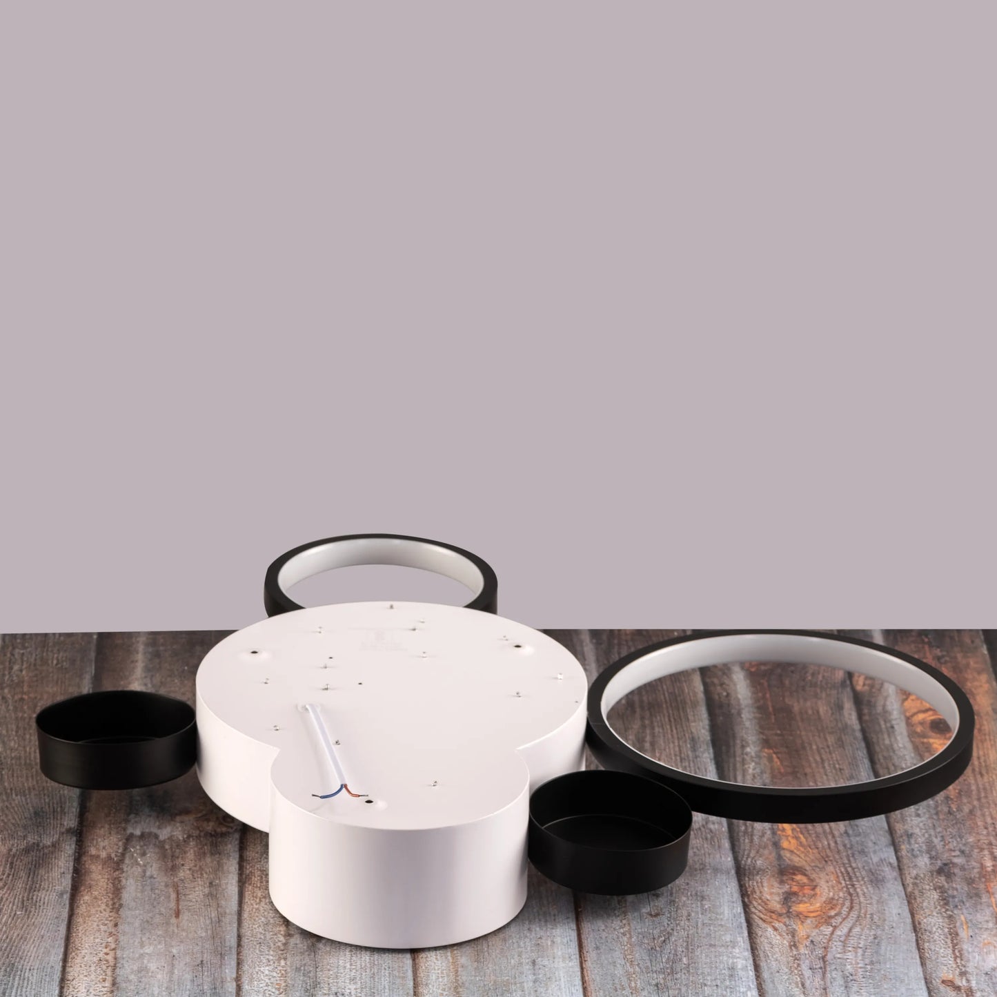 Medium-sized Heat Wave LED ceiling light brightening a cozy bedroom