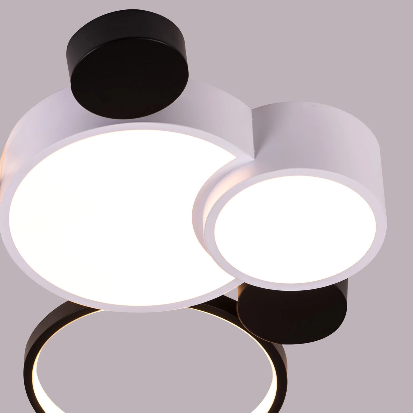 Medium-sized Heat Wave LED ceiling light brightening a cozy bedroom