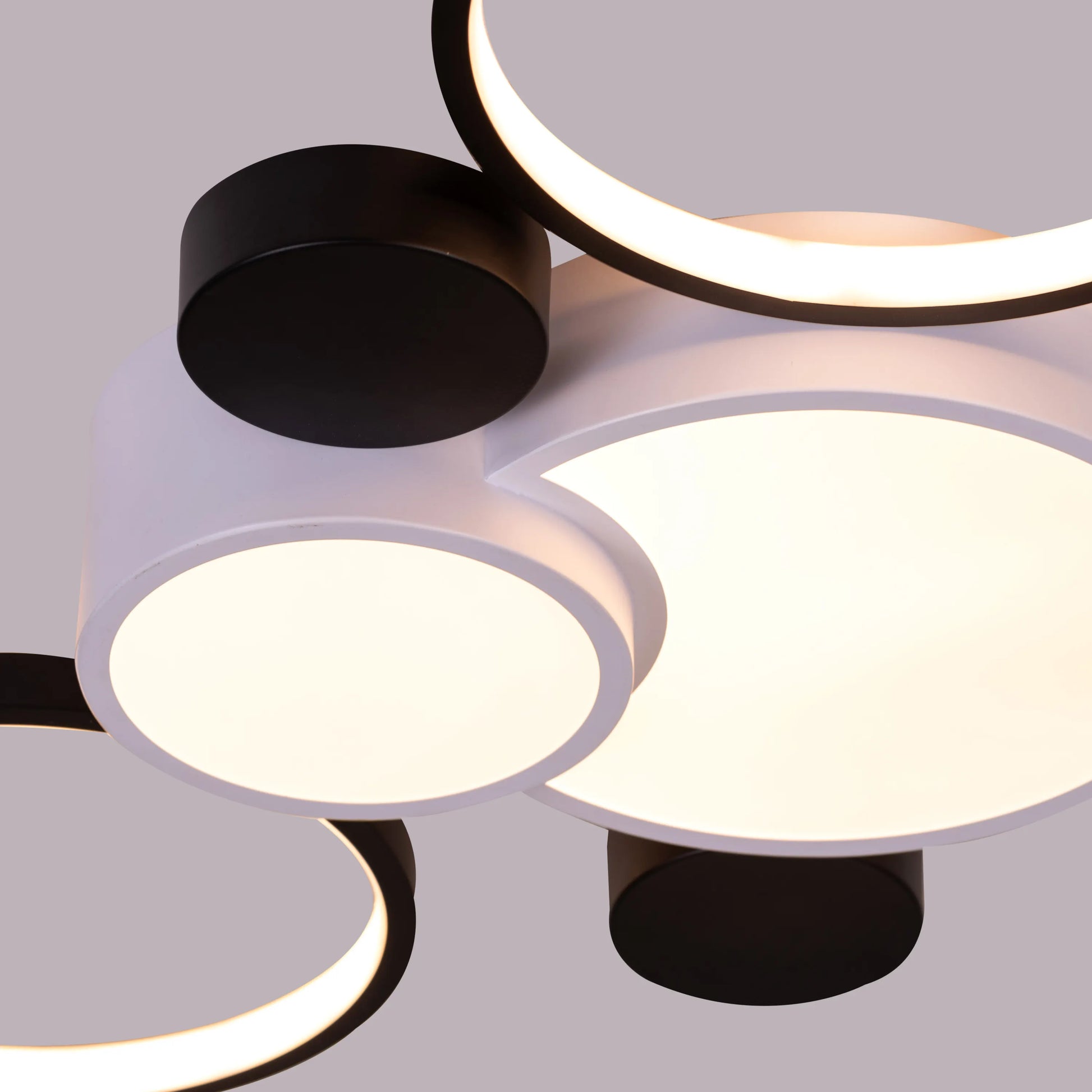 Large white Heat Wave LED ceiling light illuminating a modern living room