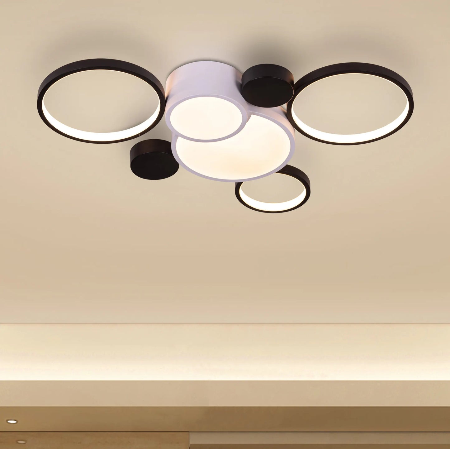 Large white Heat Wave LED ceiling light illuminating a modern living room