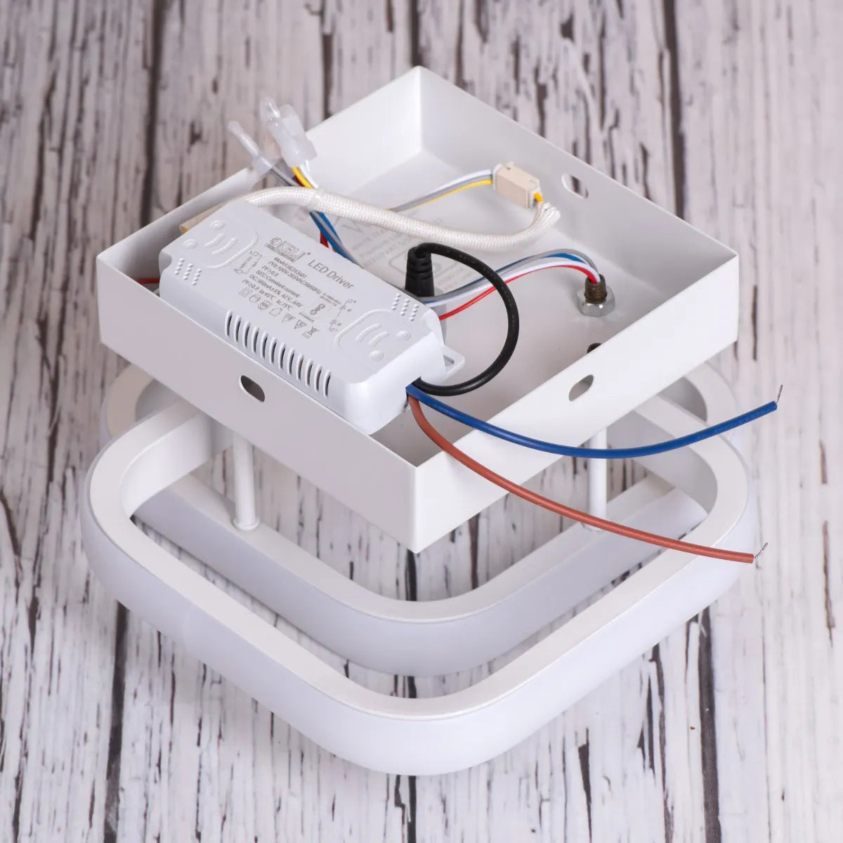 Contemporary ceiling light featuring white finish and dimmable options.