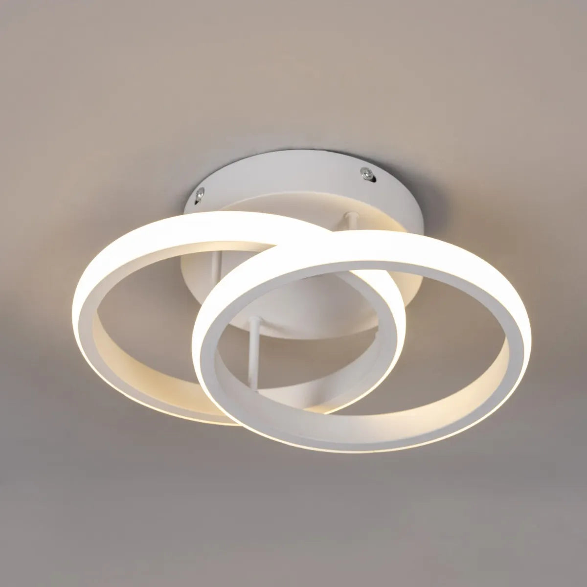 Modern ceiling light featuring white finish and adjustable LED.