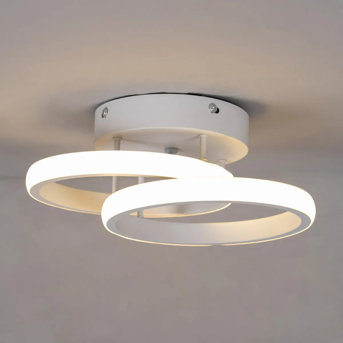 White ceiling light with remote control and adjustable color settings.