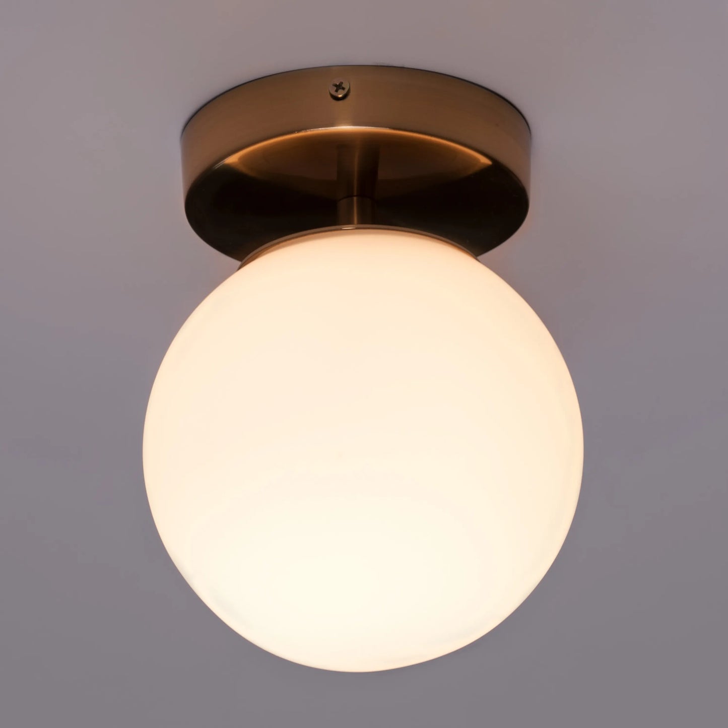 Single Life Small Gold Ceiling Light illuminating a cozy bedroom corner