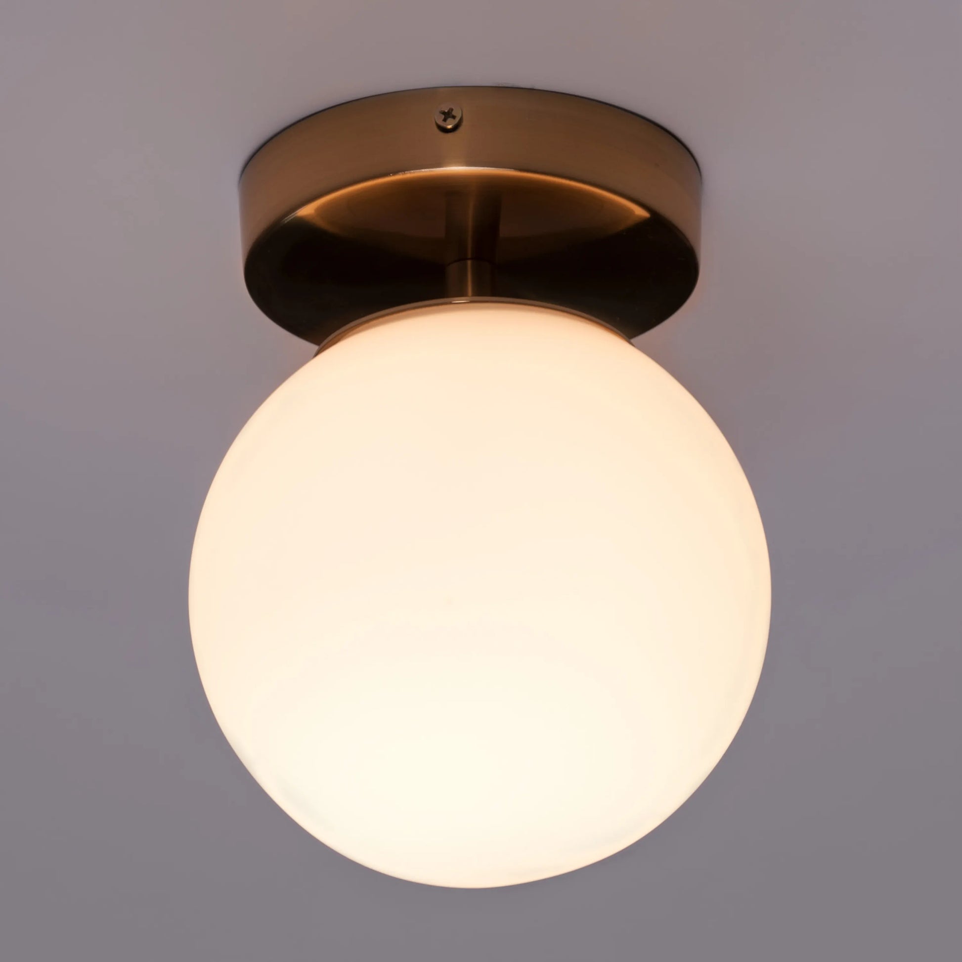 Single Life Small Gold Ceiling Light illuminating a cozy bedroom corner