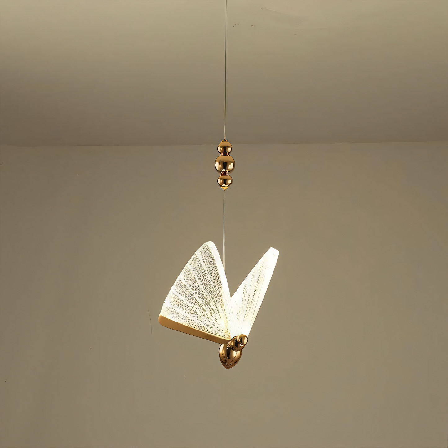 Delicate and graceful hanging light fixture with a butterfly design