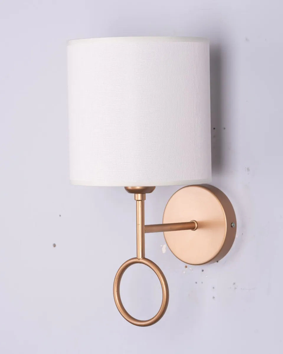 Elegant bedside wall light with soft, warm glow; minimalist design for luxury bedroom ambiance.