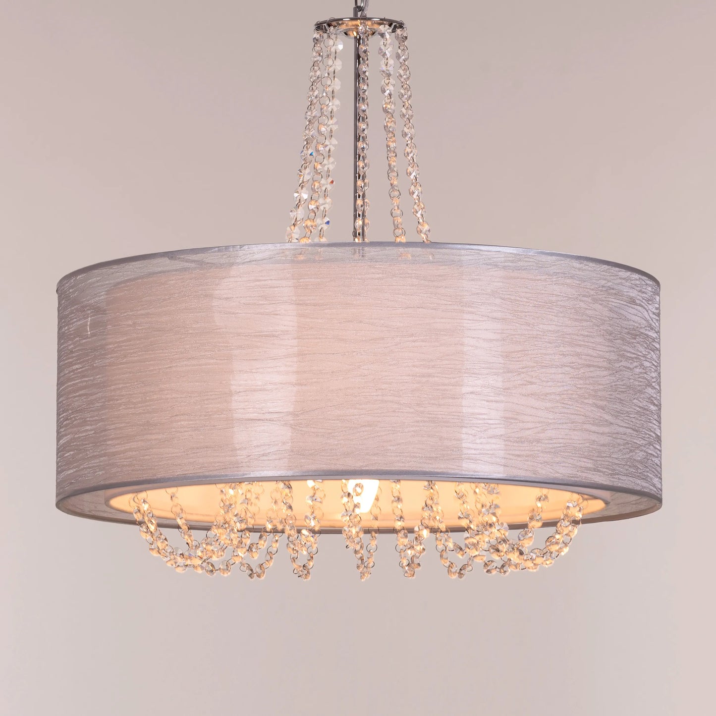 Gorgeous Girl crystal chandelier illuminating a lavish dining room.