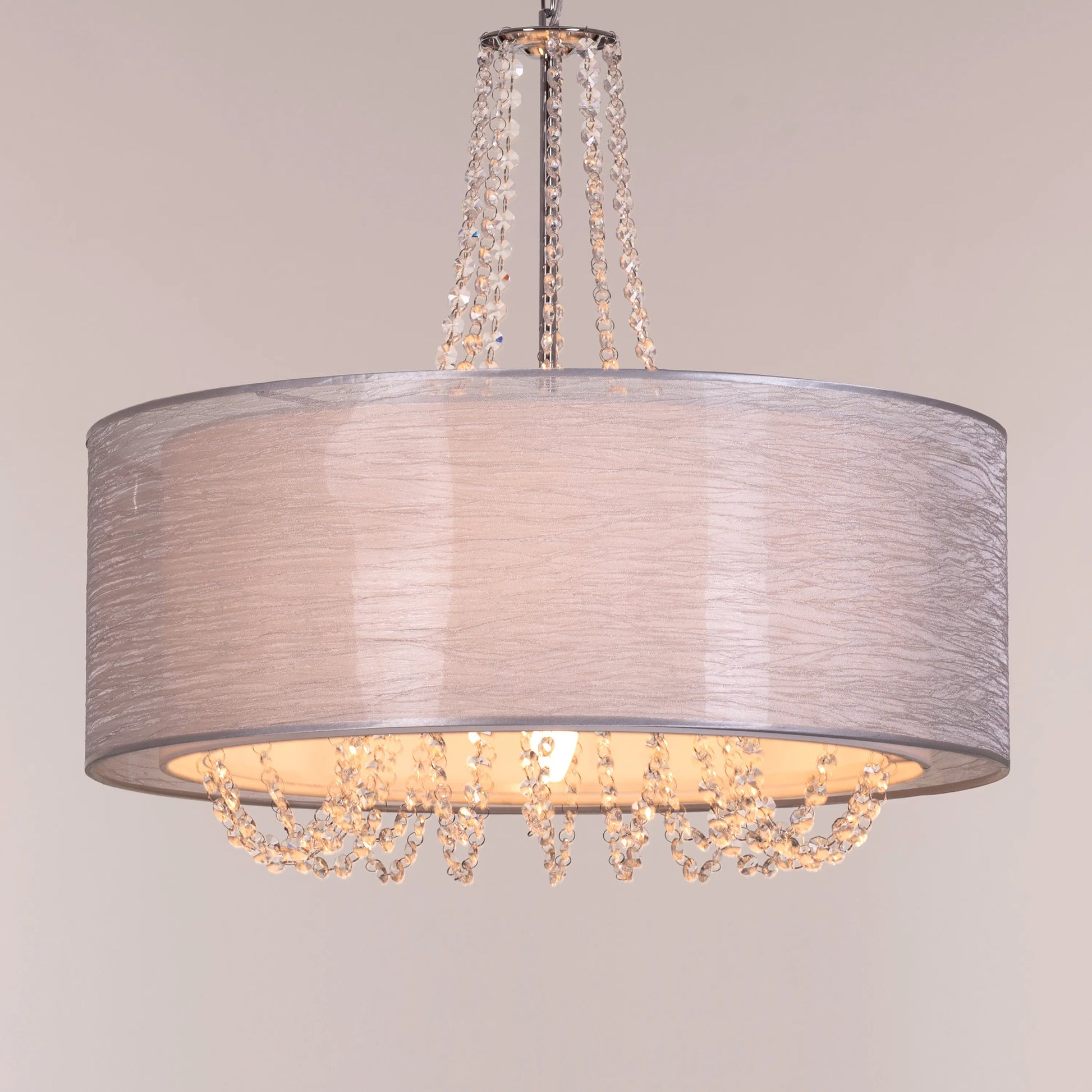 Gorgeous Girl crystal chandelier illuminating a lavish dining room.