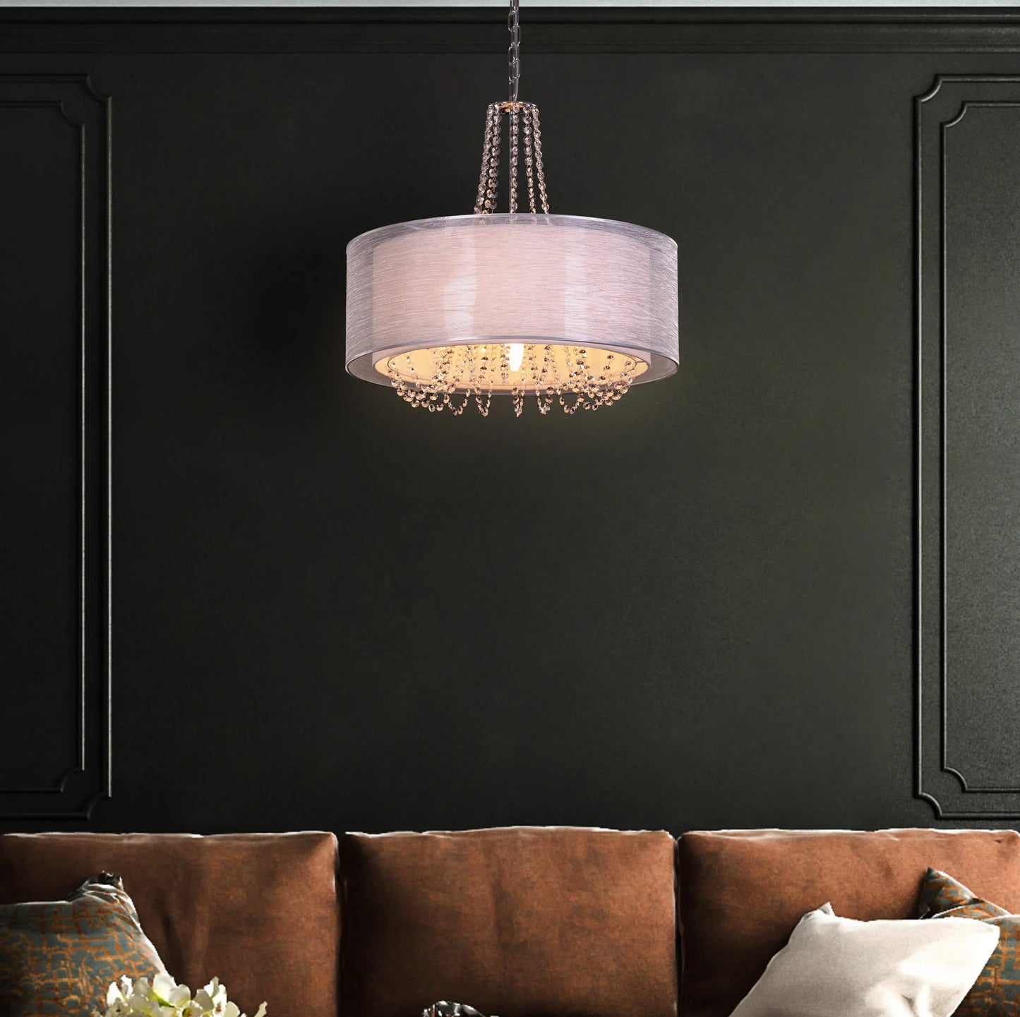 Gorgeous Girl crystal chandelier illuminating a lavish dining room.