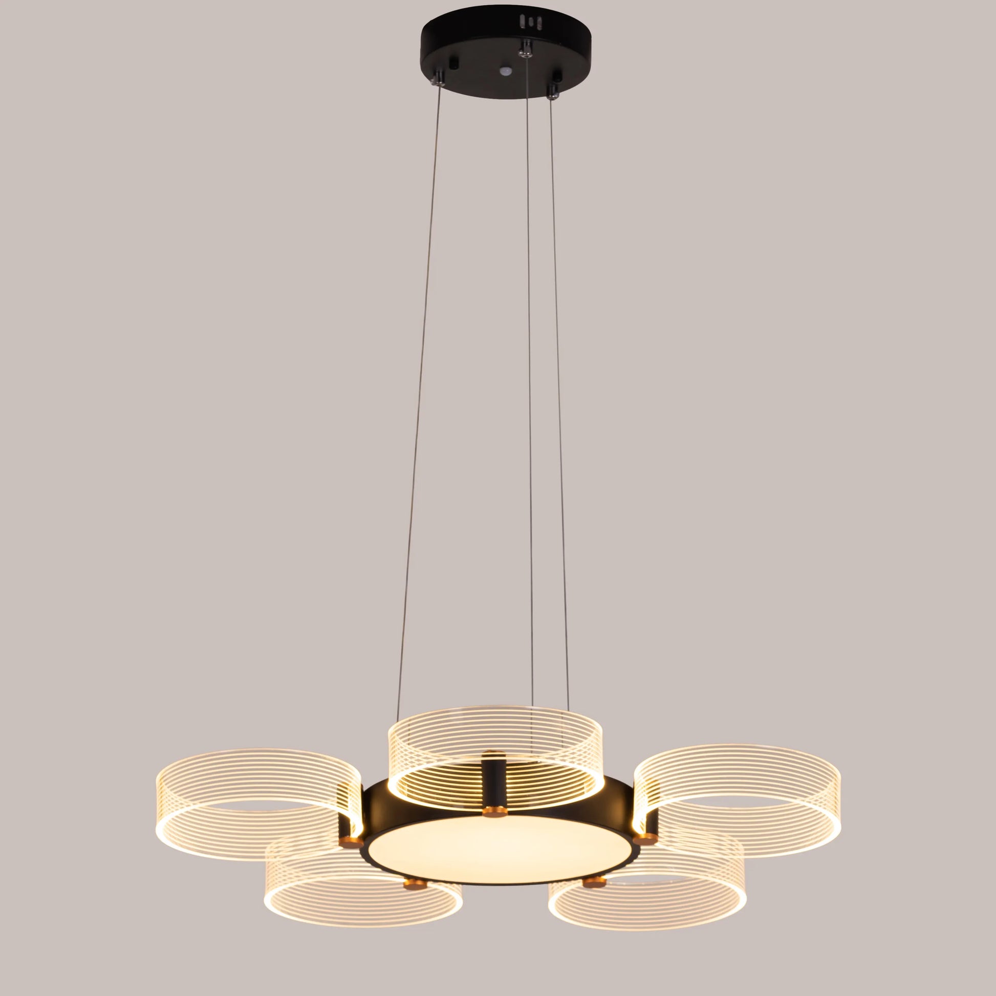 Stylish Meet And Greet Chandelier with five adjustable heads in a modern living room.