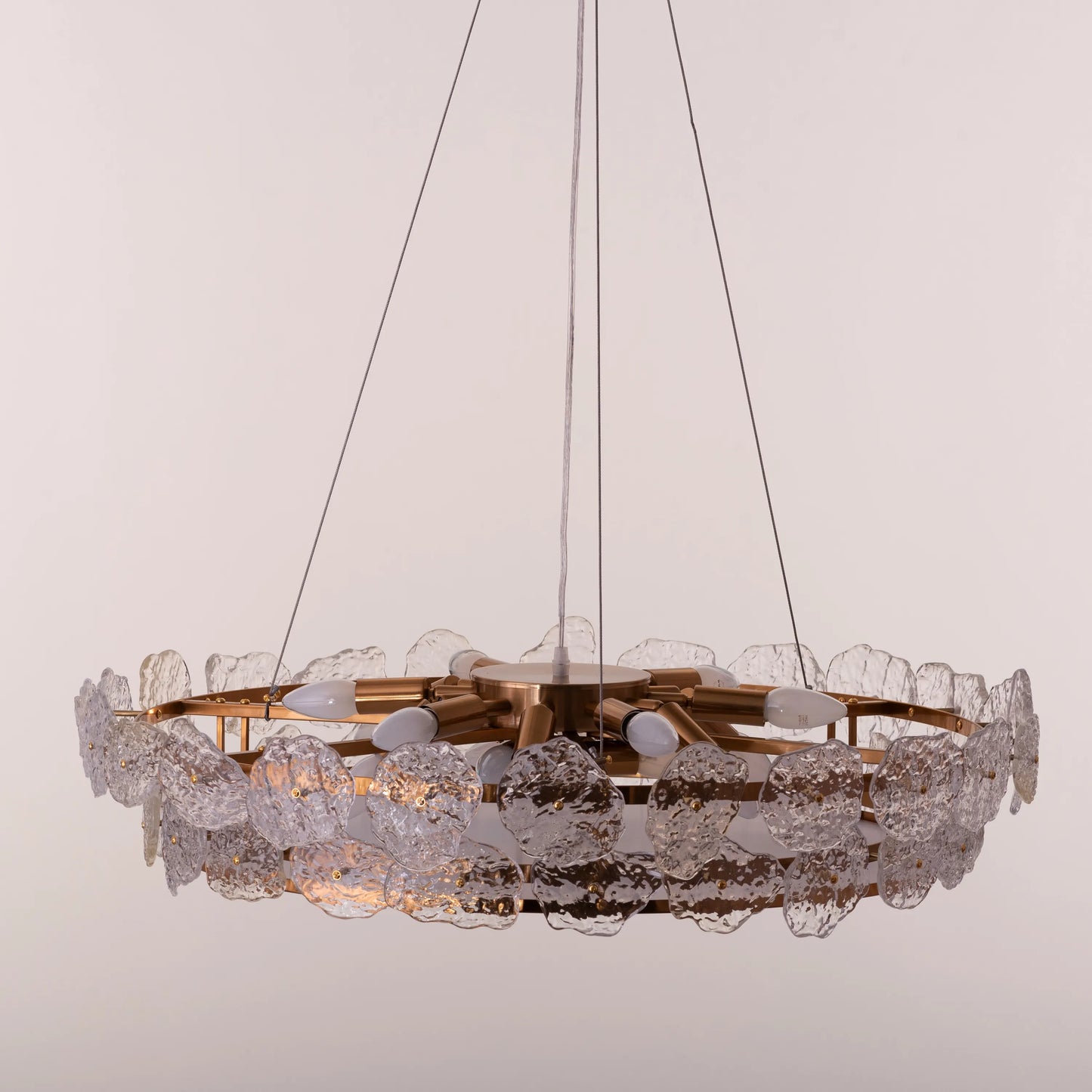 Run This Town large gold crystal chandelier illuminating a sleek urban loft