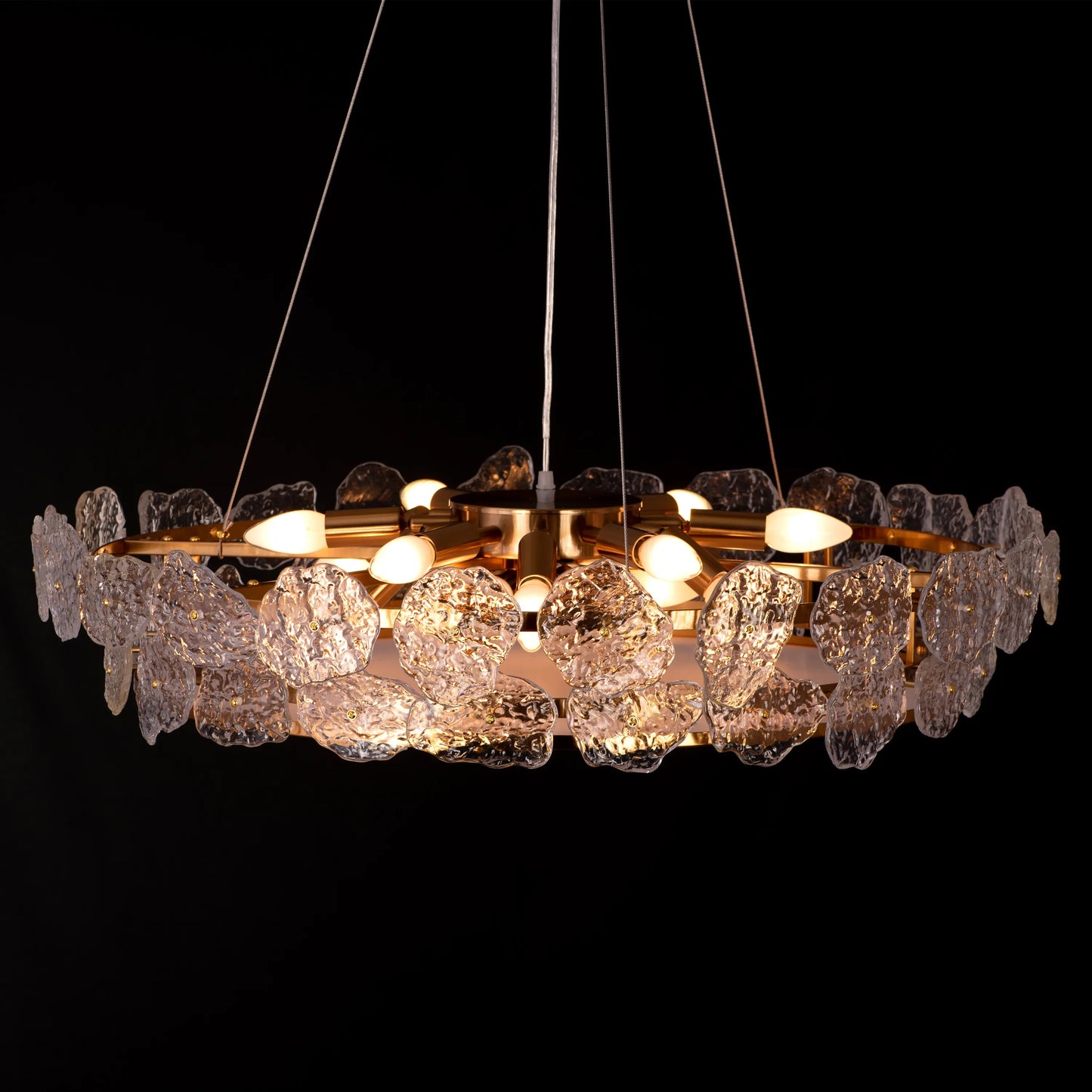 Run This Town large gold crystal chandelier illuminating a sleek urban loft