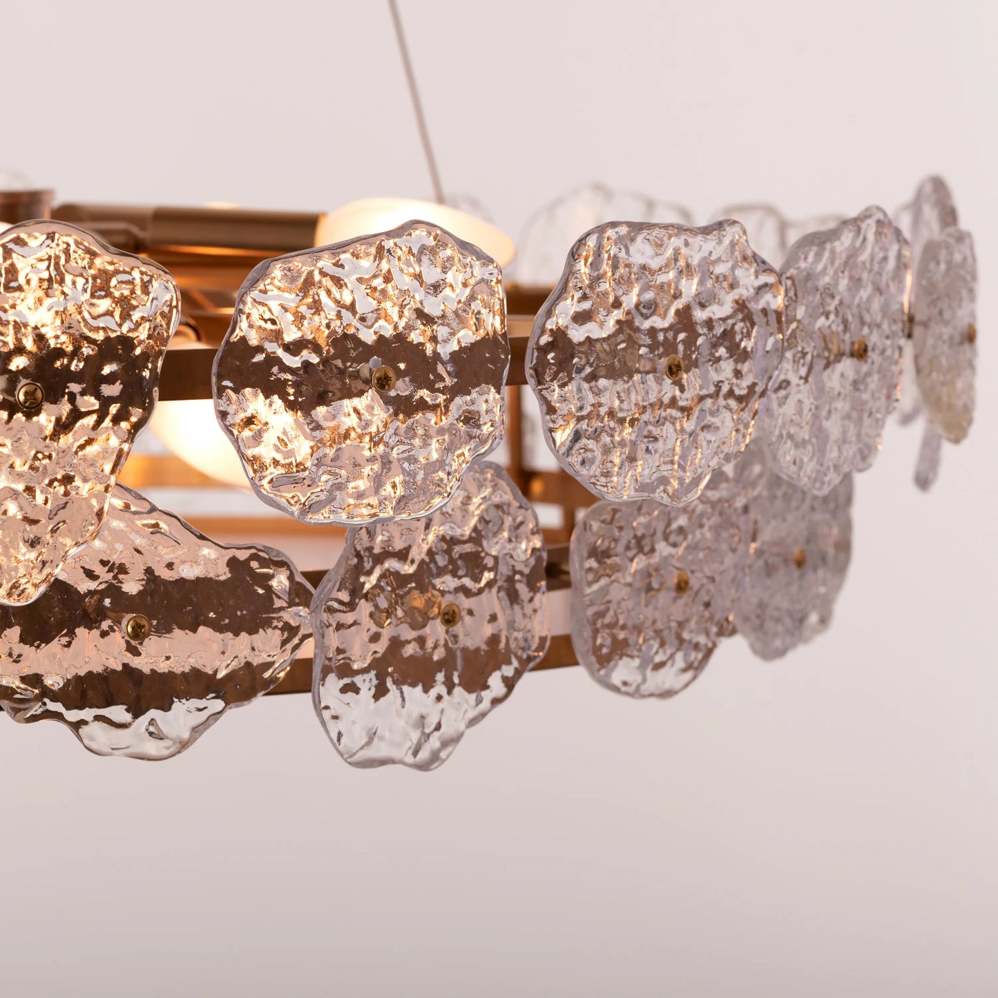 Run This Town large gold crystal chandelier illuminating a sleek urban loft