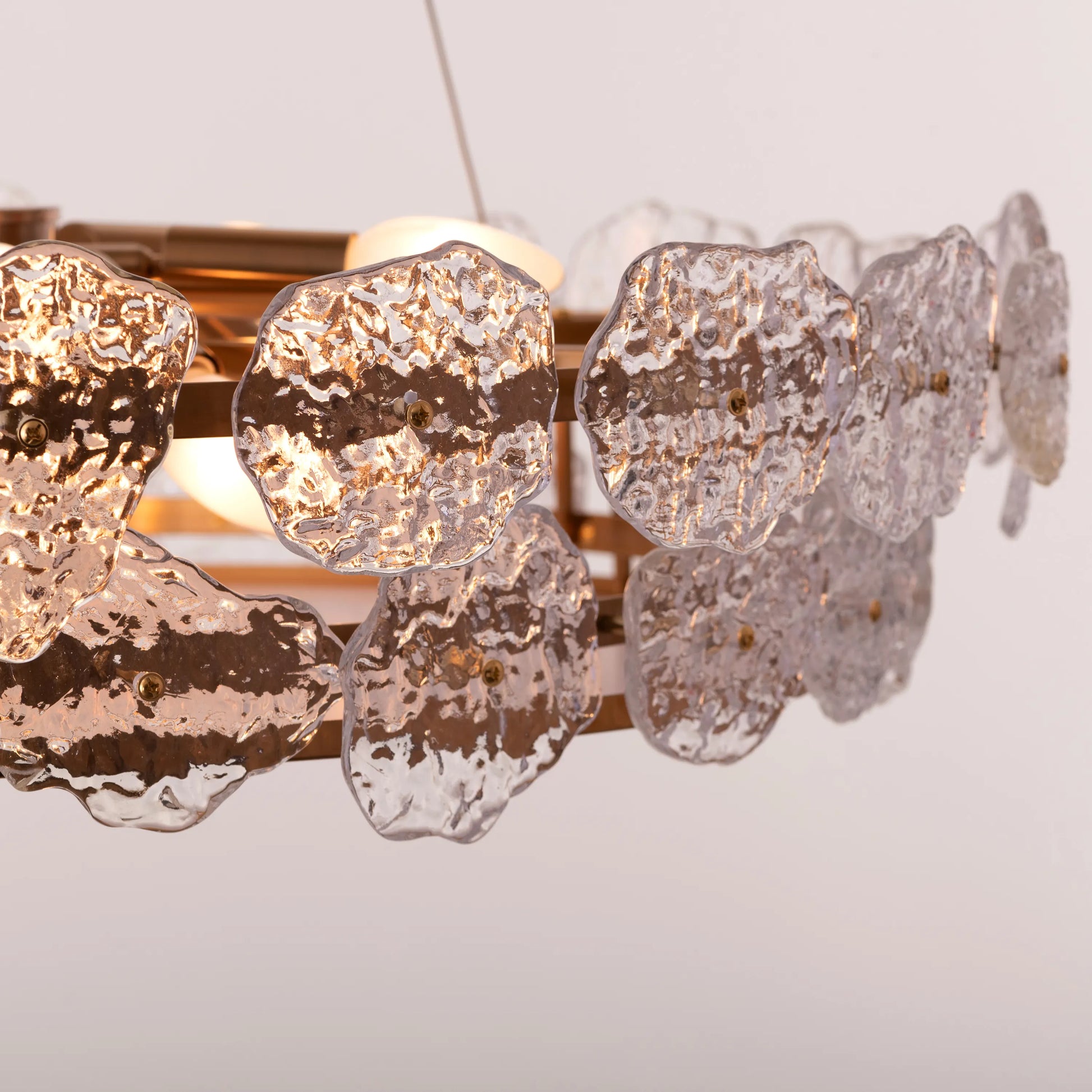 Run This Town large gold crystal chandelier illuminating a sleek urban loft