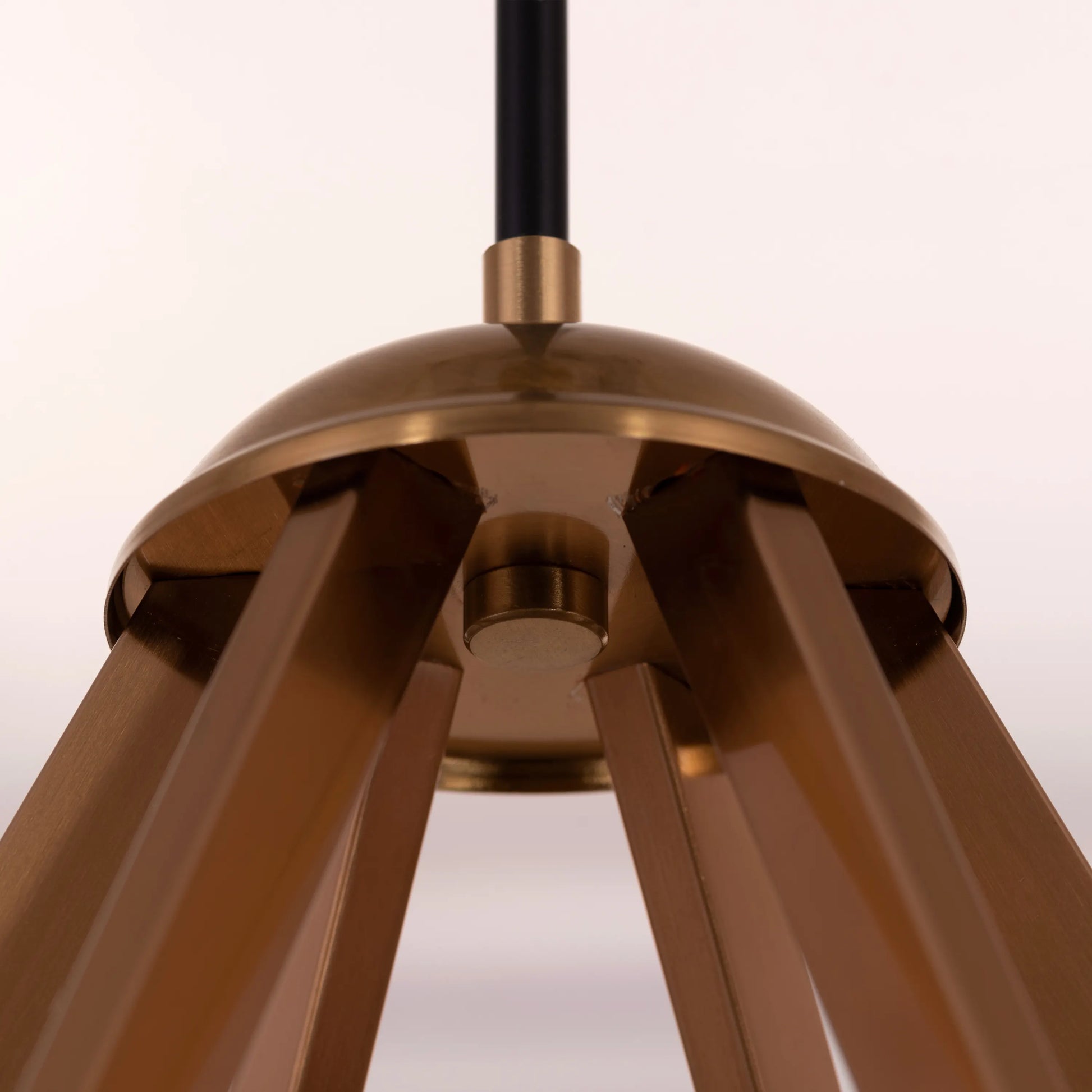 Prime Time Chandelier suspended in an elegant living room, its concentric gold rings casting a warm, inviting glow that draws the eye upward.