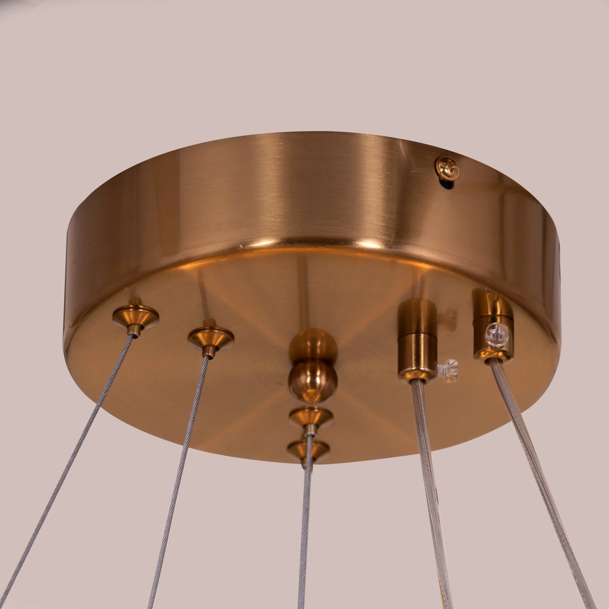 Bring A Friend medium gold chandelier with dimmable LED lights illuminating a modern dining room