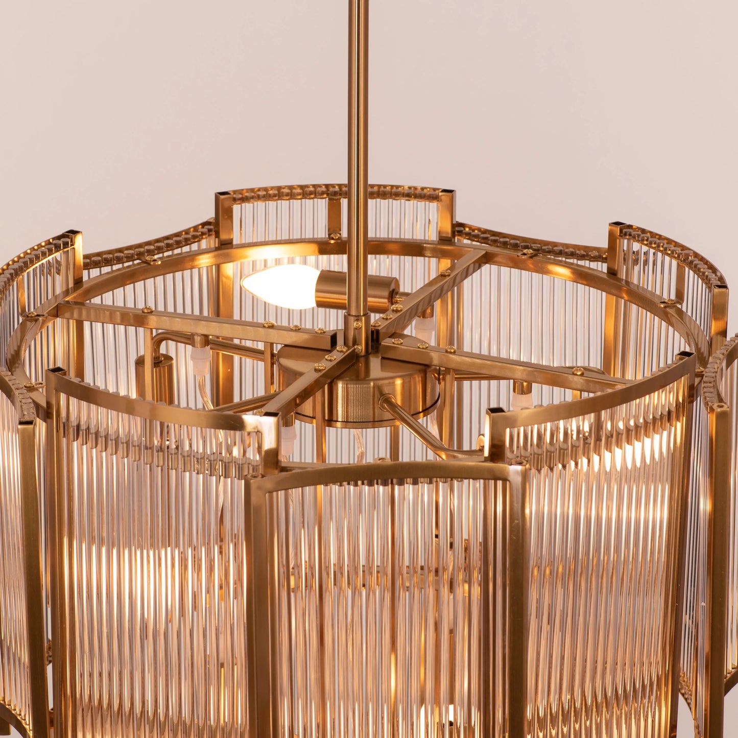 Melrose Place gold chandelier with tiered crystal drops illuminating a luxurious dining room