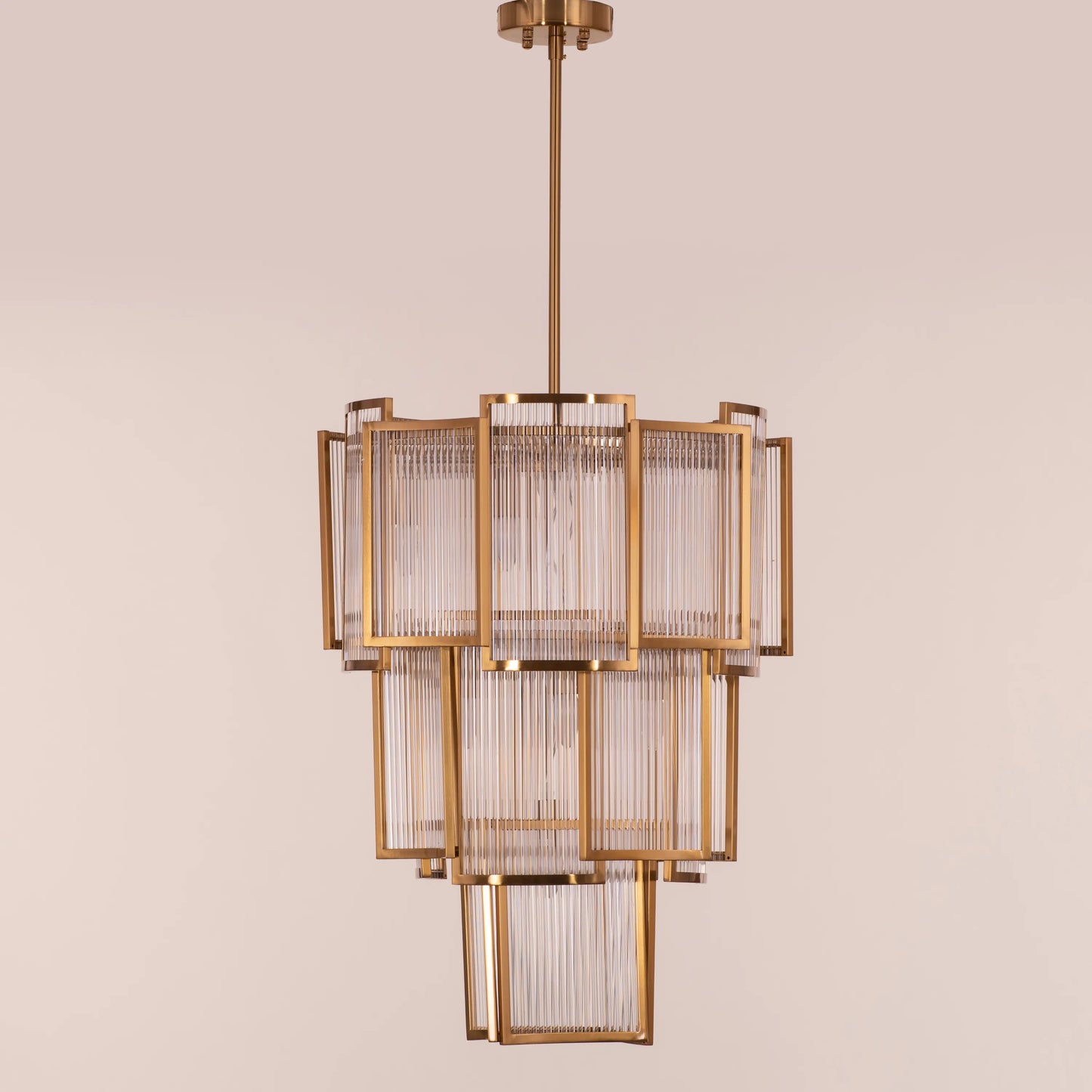 Melrose Place gold chandelier with tiered crystal drops illuminating a luxurious dining room