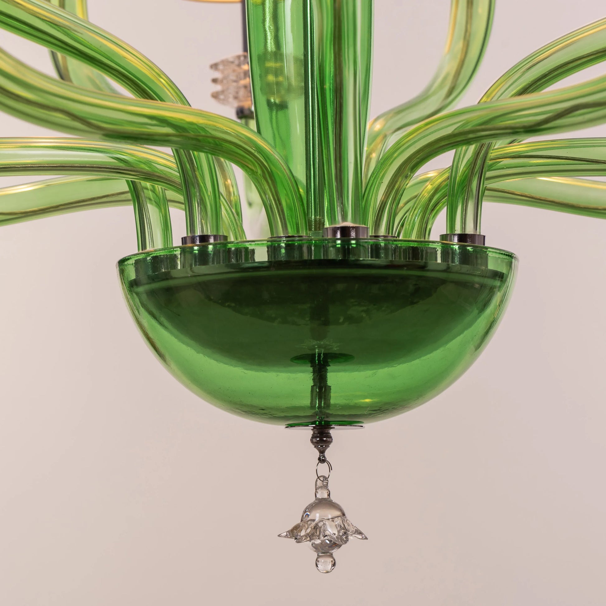 Large green and white glass chandelier with cloud-like forms and warm lighting