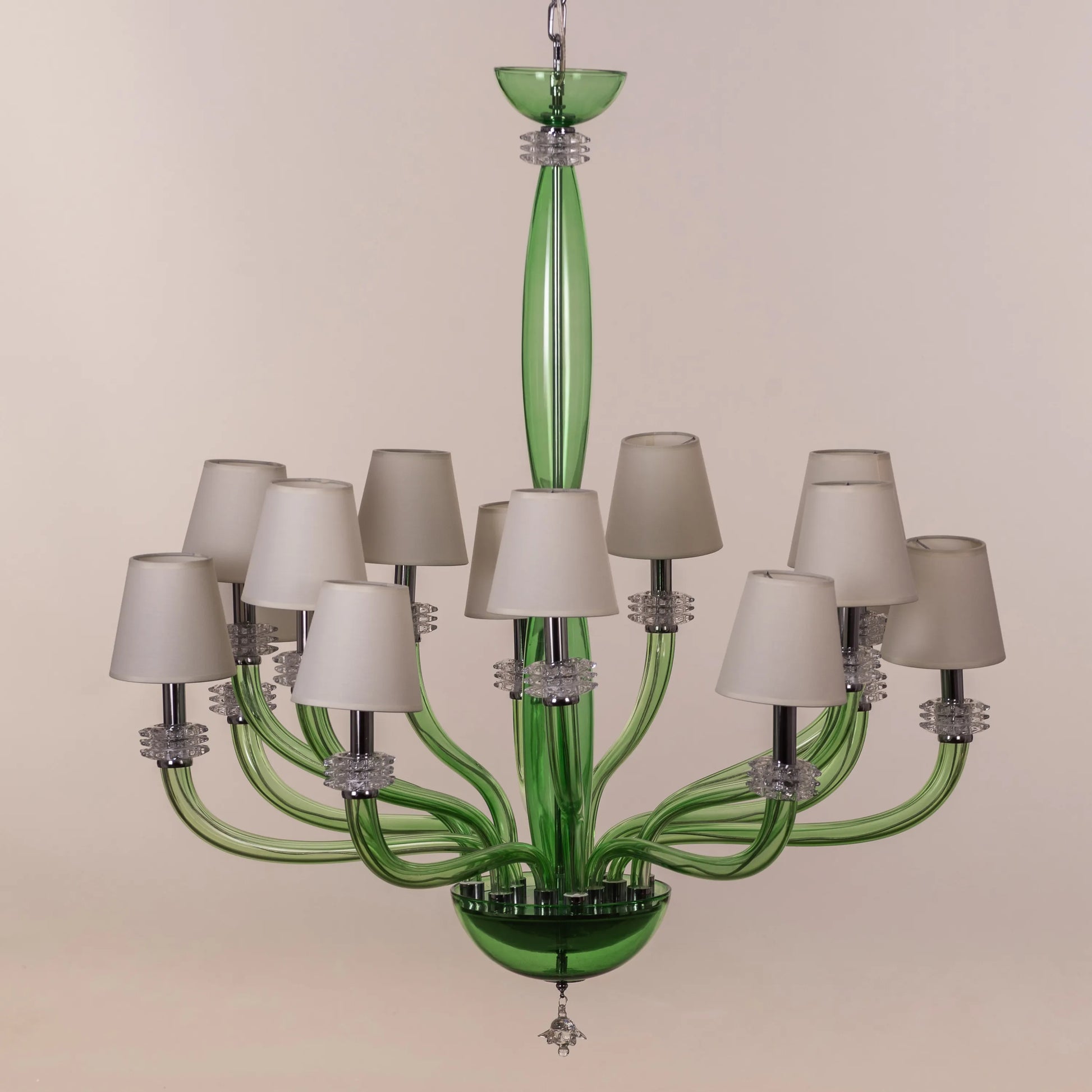 Large green and white glass chandelier with cloud-like forms and warm lighting