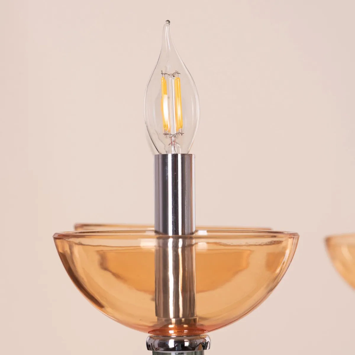 Large "Steps Of Rome" chandelier with tiered green and amber glass elements, dramatically illuminated in a spacious, elegant room.