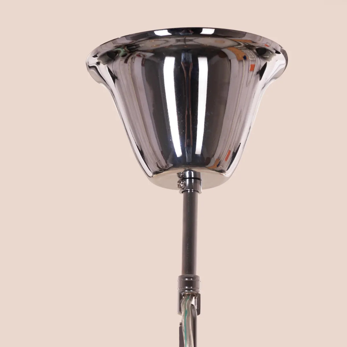 Large "Steps Of Rome" chandelier with tiered green and amber glass elements, dramatically illuminated in a spacious, elegant room.