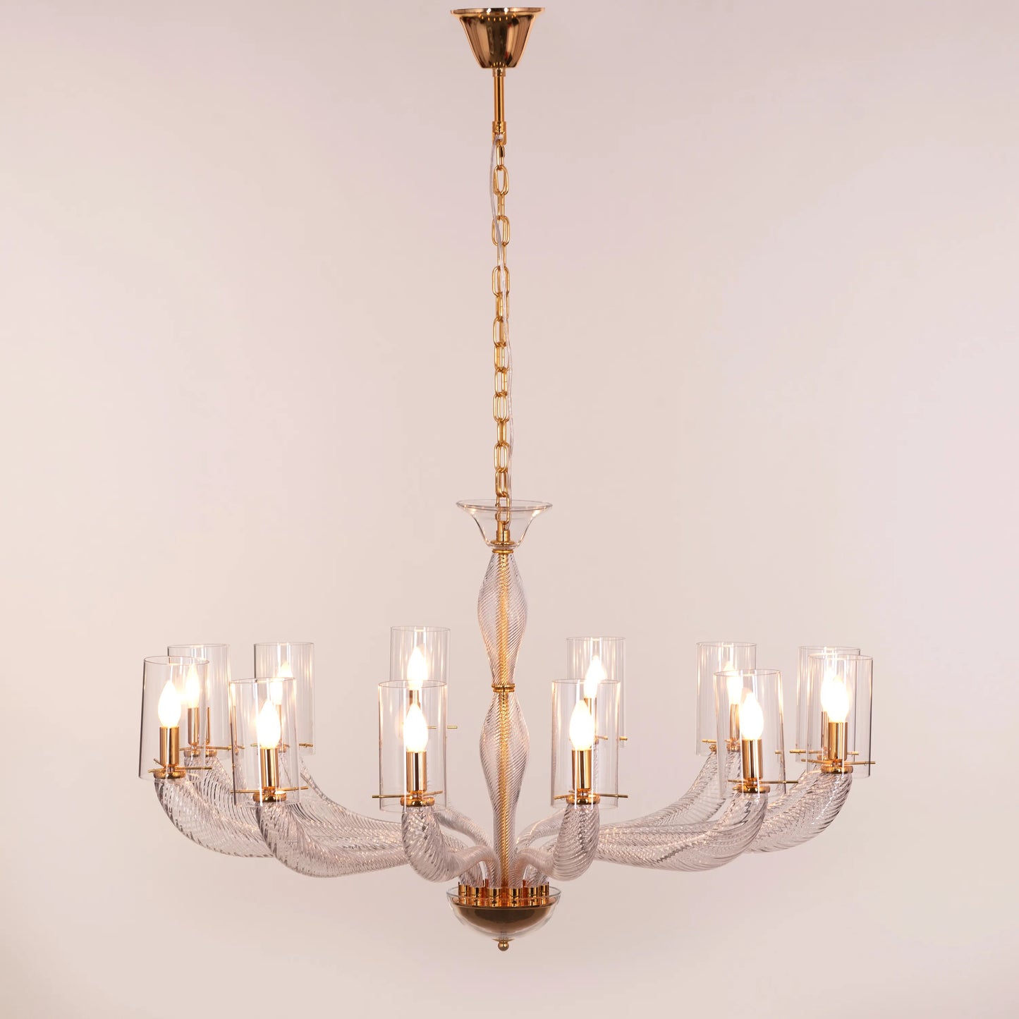 Midnight In Paris large gold glass chandelier illuminating an elegant living room