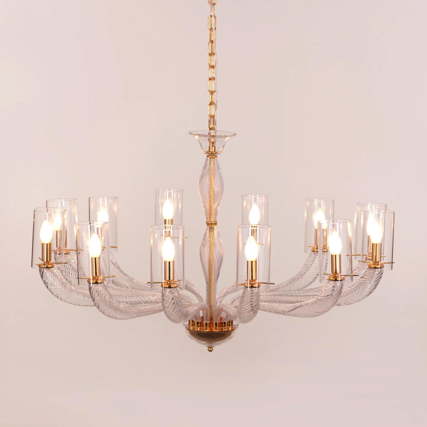 Midnight In Paris large gold glass chandelier illuminating an elegant living room