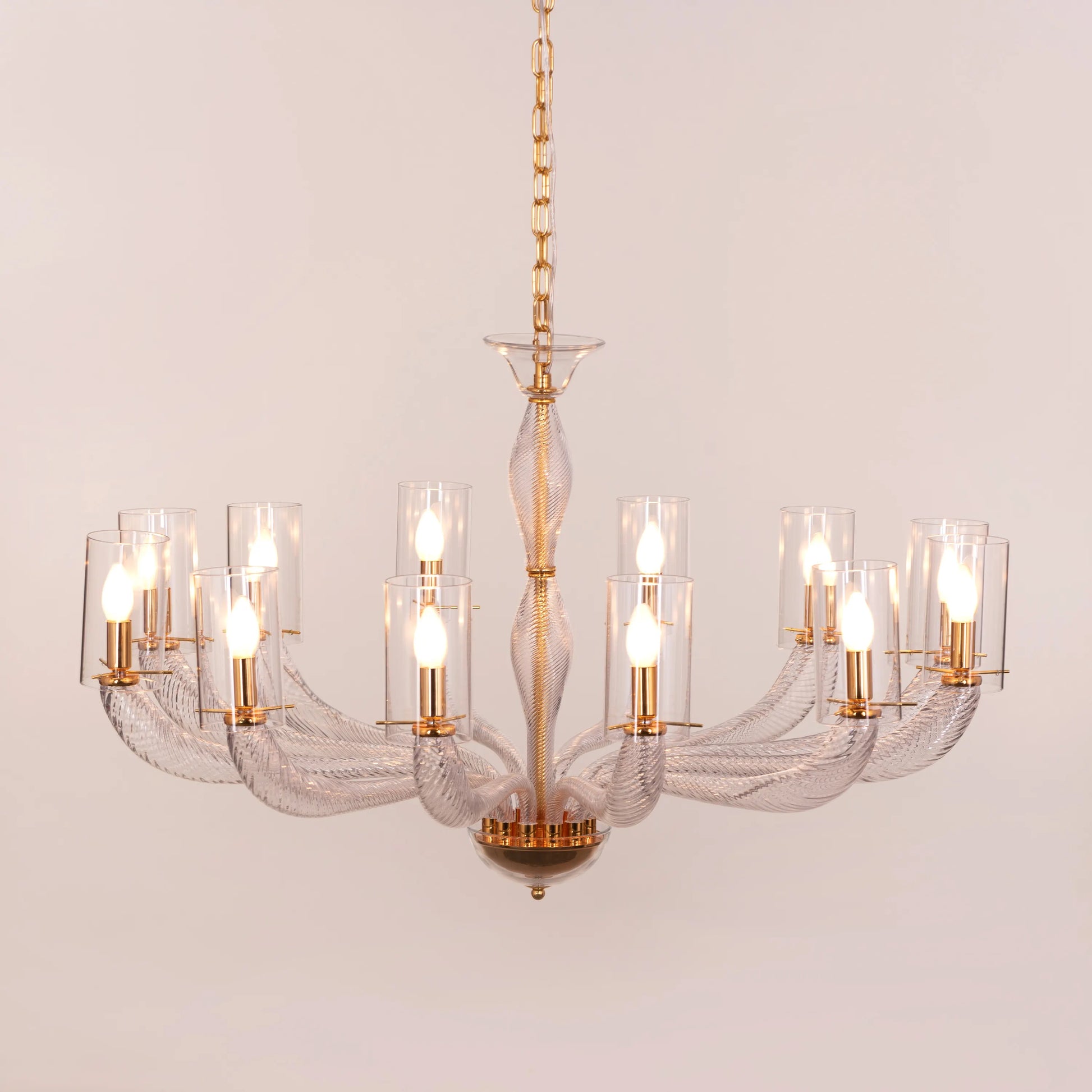 Midnight In Paris large gold glass chandelier illuminating an elegant living room