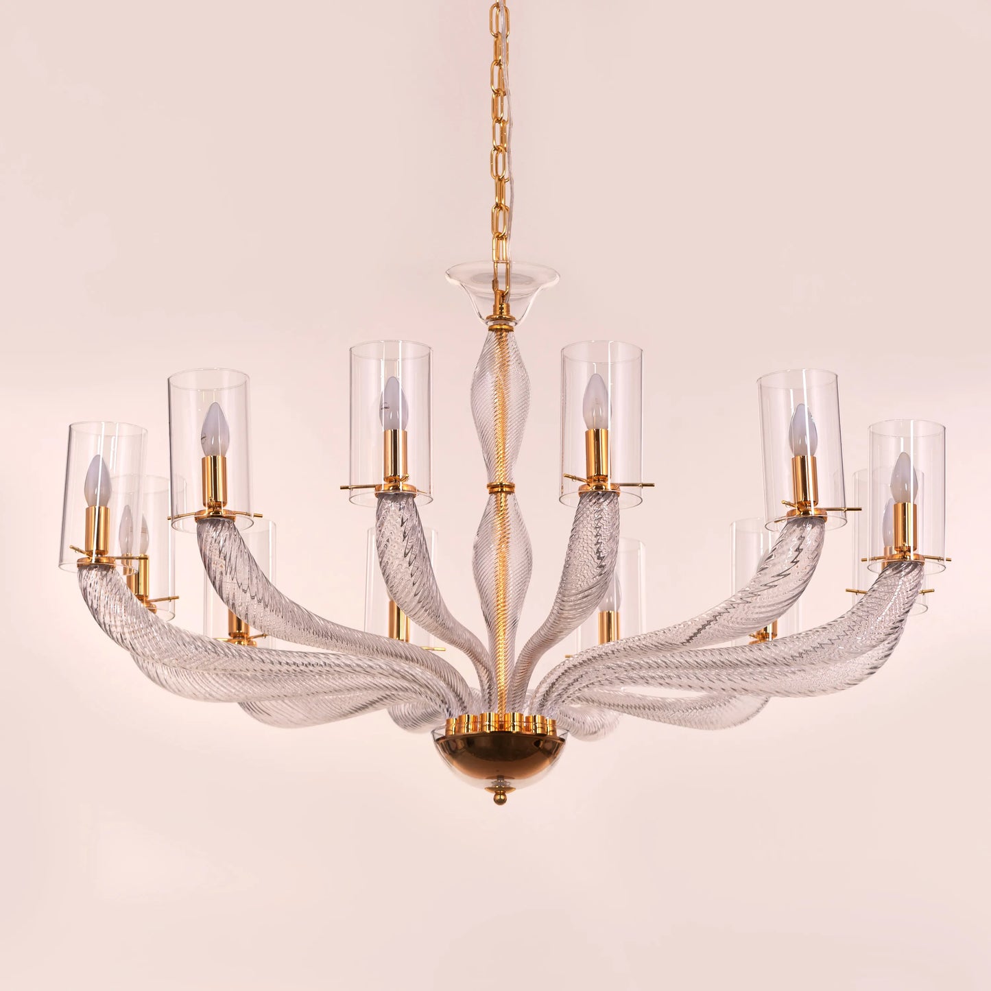 Midnight In Paris large gold glass chandelier illuminating an elegant living room