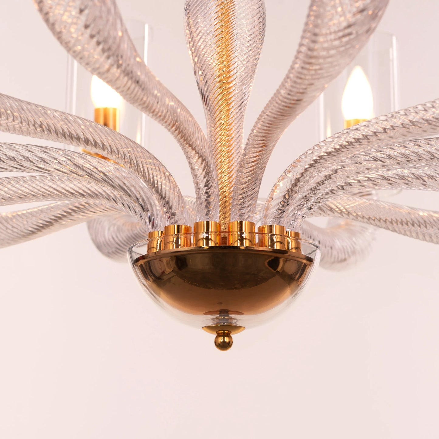 Midnight In Paris large gold glass chandelier illuminating an elegant living room