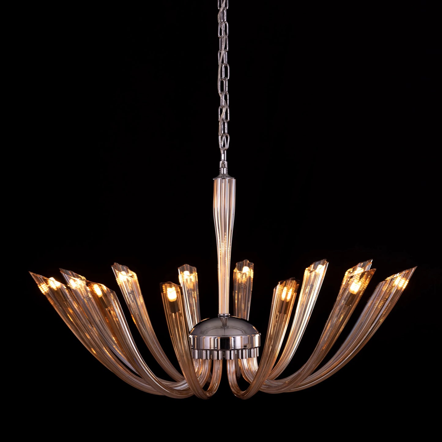 Landslide large brown glass chandelier illuminating a spacious living room with its warm, amber glow