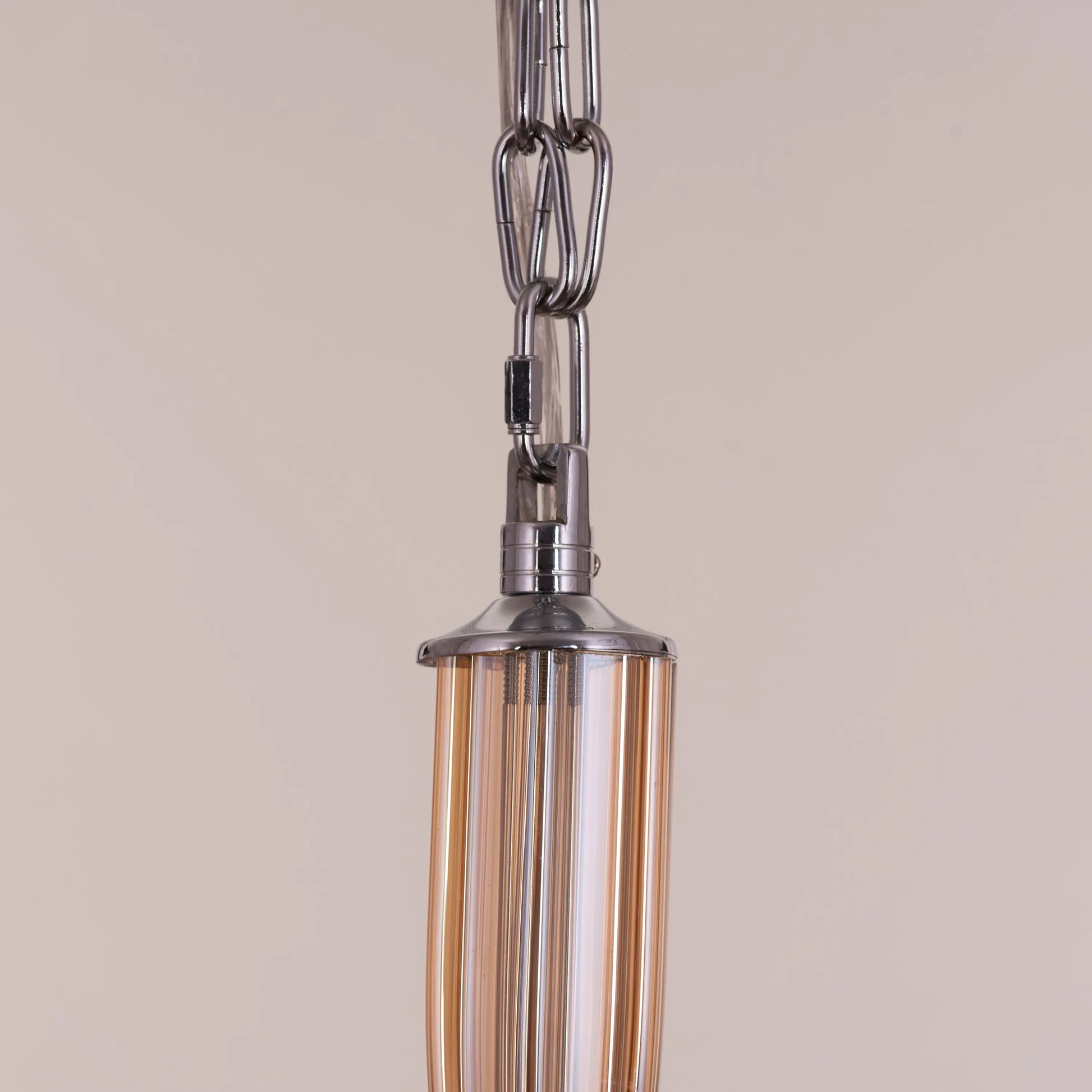 Landslide large brown glass chandelier illuminating a spacious living room with its warm, amber glow