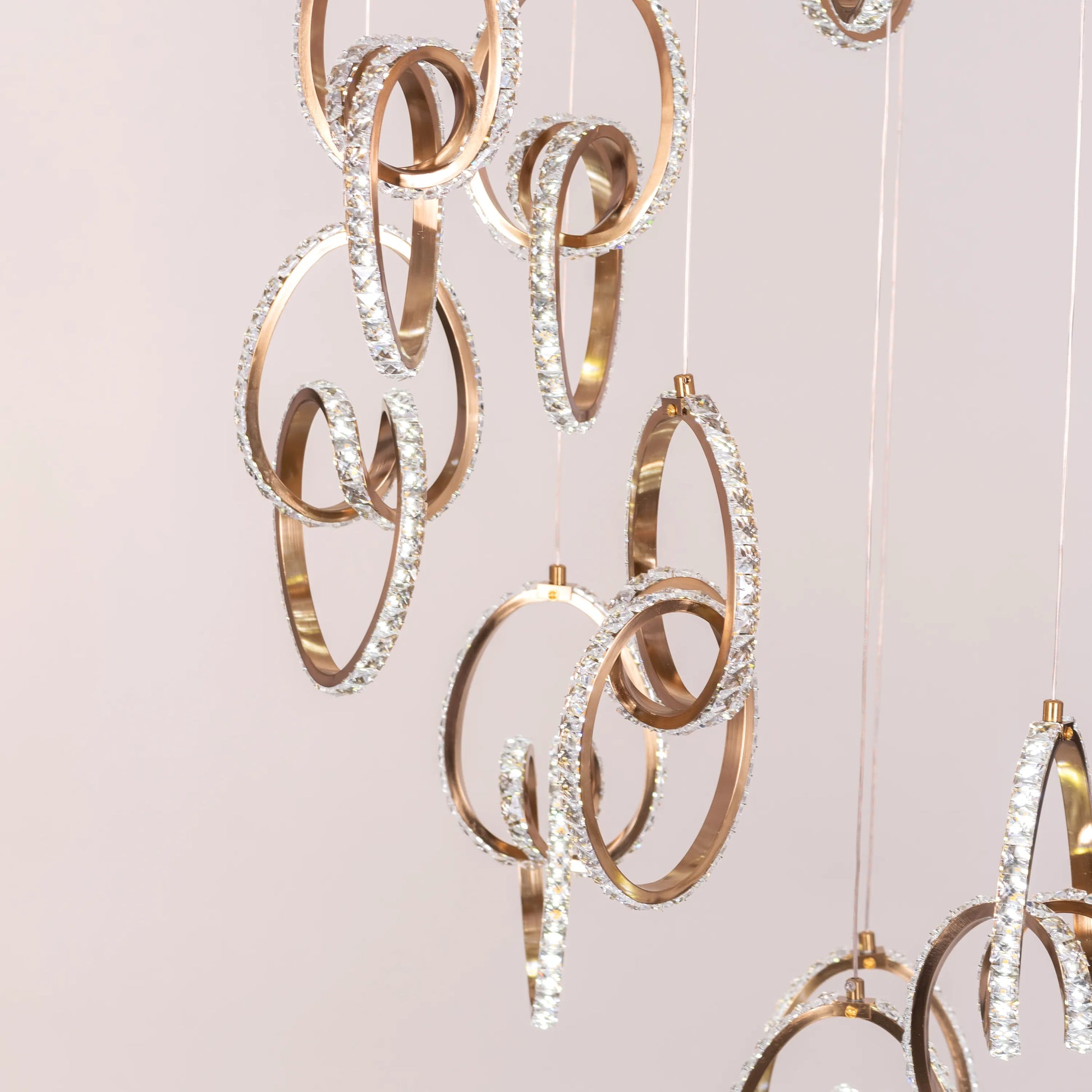 Stunning gold and crystal double-height chandelier with dimmable LED lights