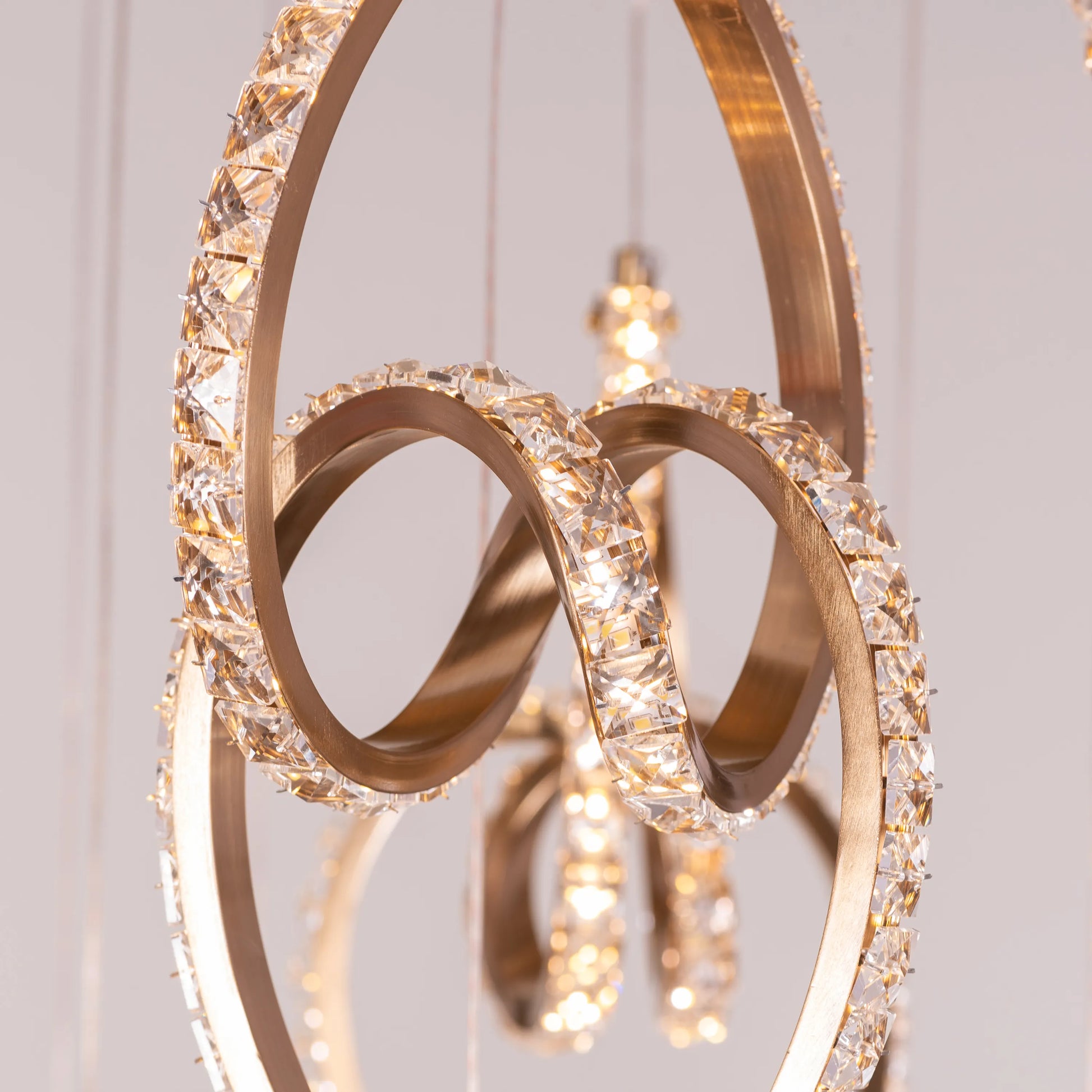 Stunning gold and crystal double-height chandelier with dimmable LED lights