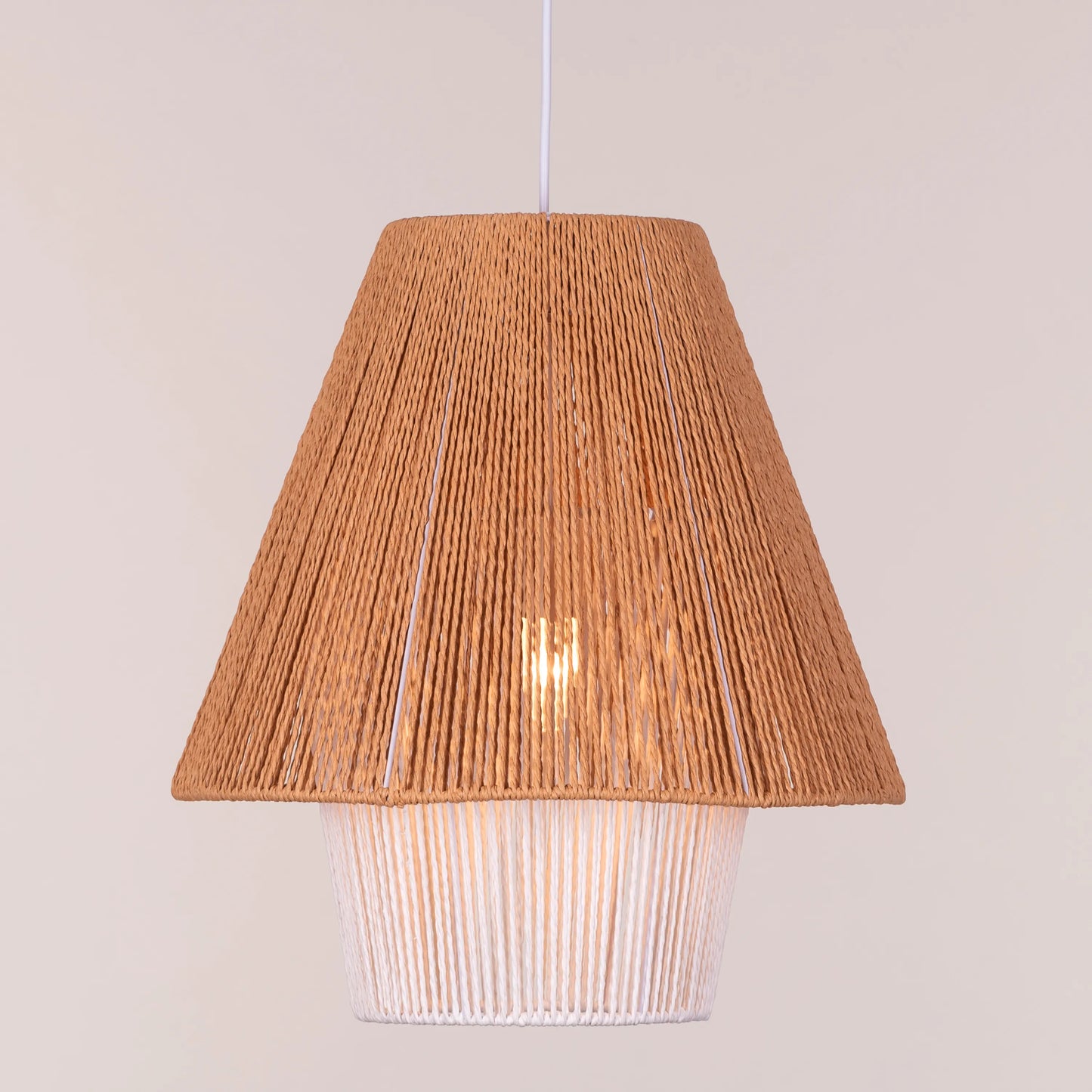 A charming rattan pendant light named 'Say What You Mean,' featuring a woven rattan shade with a bold, open design. The natural fibers create an inviting atmosphere as light filters through, casting playful shadows. This pendant combines bohemian style with a contemporary touch, making it a perfect addition to any space seeking warmth and character.