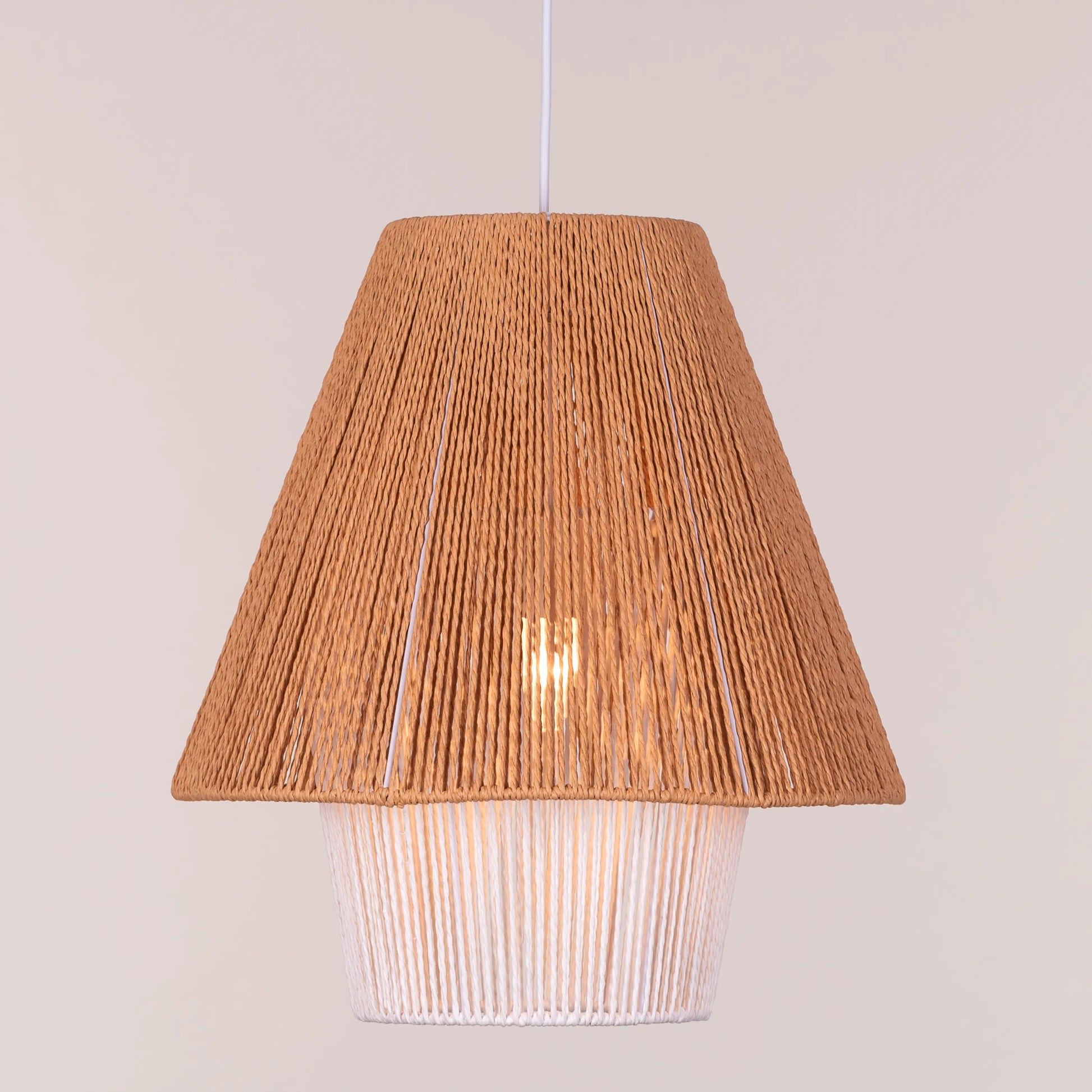 A charming rattan pendant light named 'Say What You Mean,' featuring a woven rattan shade with a bold, open design. The natural fibers create an inviting atmosphere as light filters through, casting playful shadows. This pendant combines bohemian style with a contemporary touch, making it a perfect addition to any space seeking warmth and character.