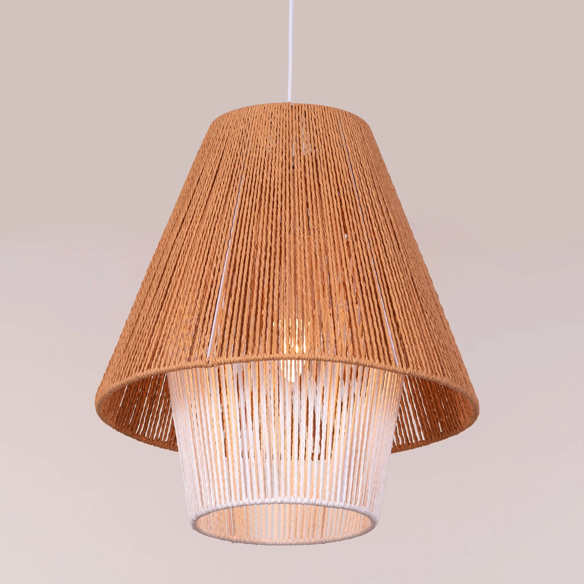 A charming rattan pendant light named 'Say What You Mean,' featuring a woven rattan shade with a bold, open design. The natural fibers create an inviting atmosphere as light filters through, casting playful shadows. This pendant combines bohemian style with a contemporary touch, making it a perfect addition to any space seeking warmth and character.
